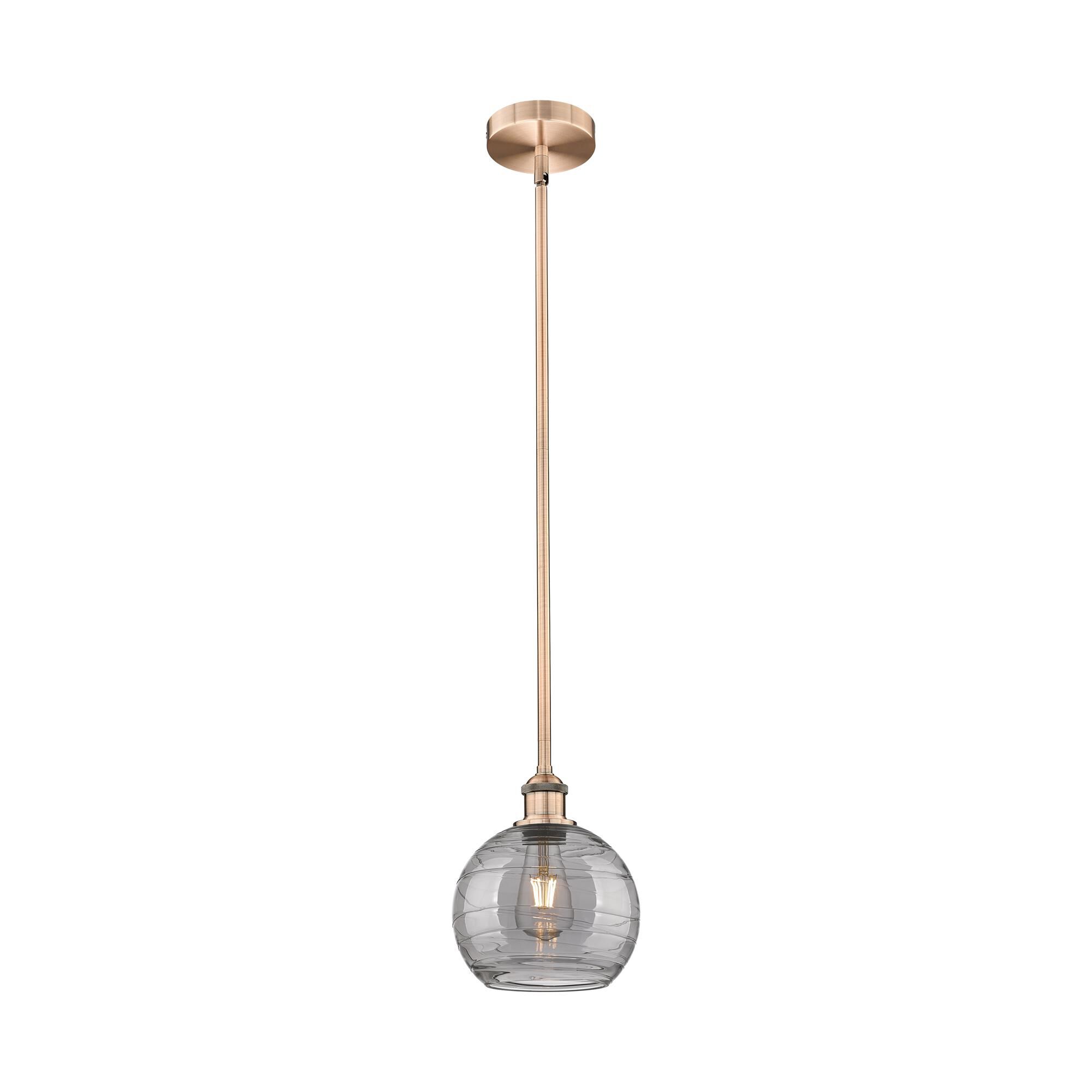 Shown in Antique Copper finish and Light Smoke Deco Swirl glass