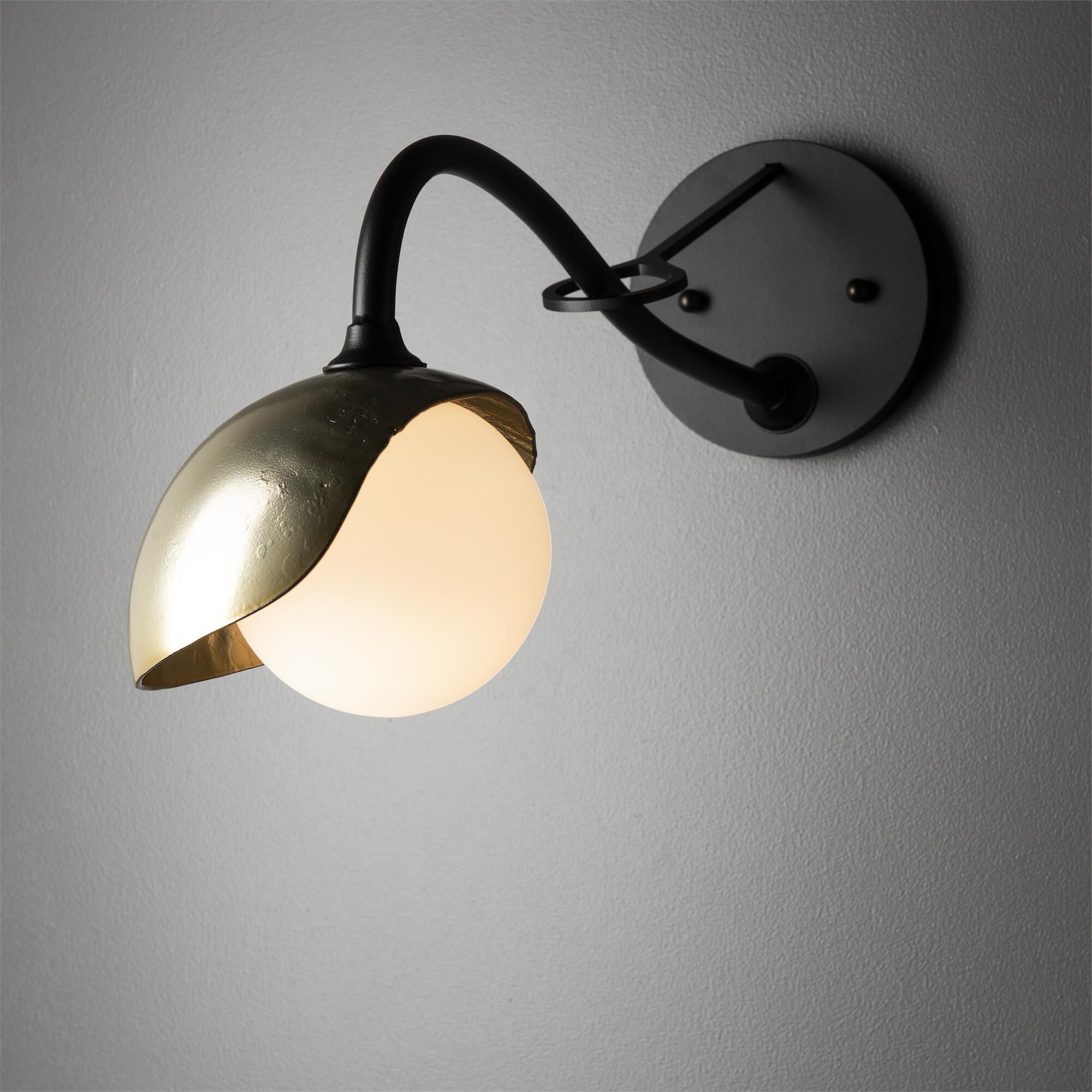 Shown in Black finish and Opal glass and Modern Brass (86) accent