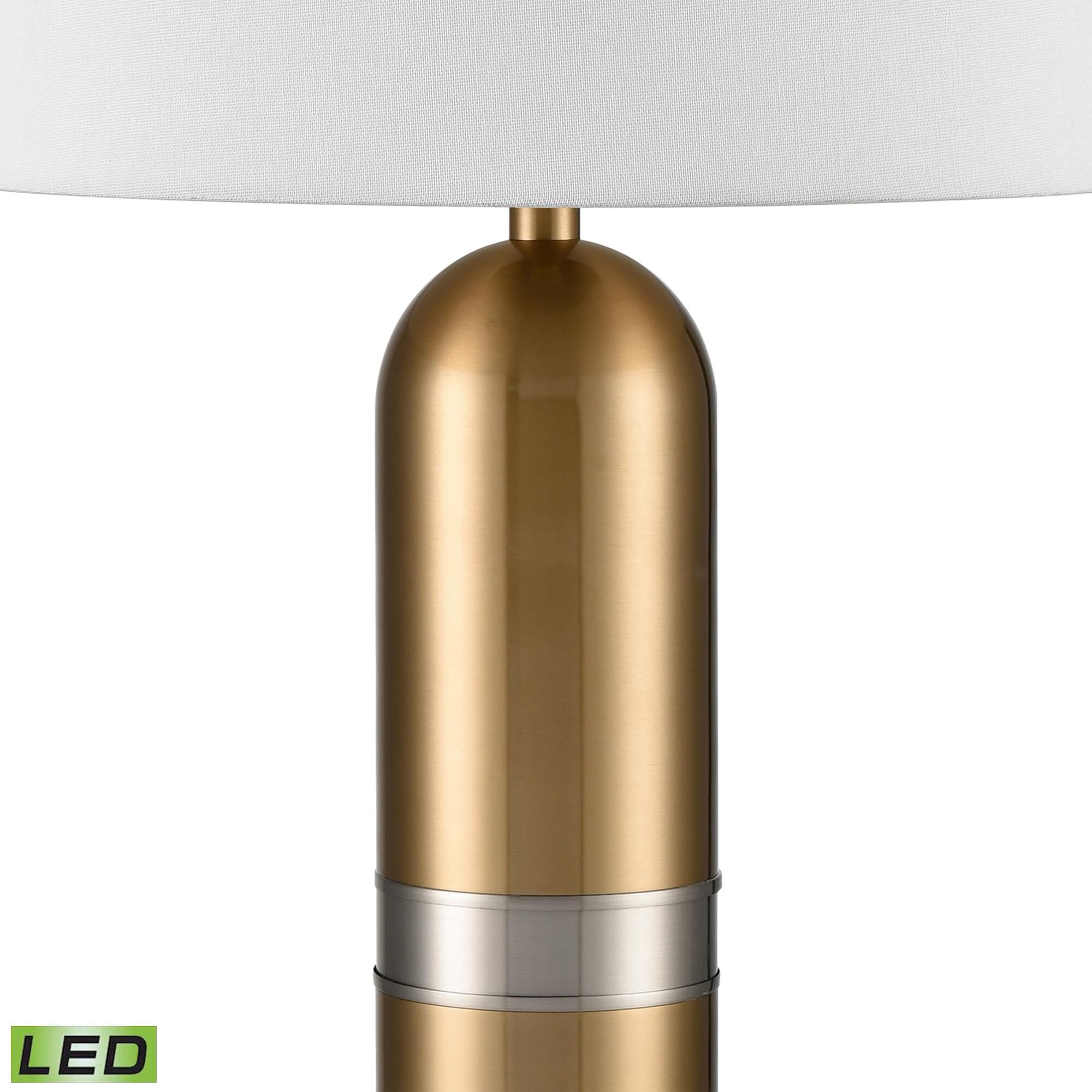 Shown in Aged Brass finish and White Linen shade