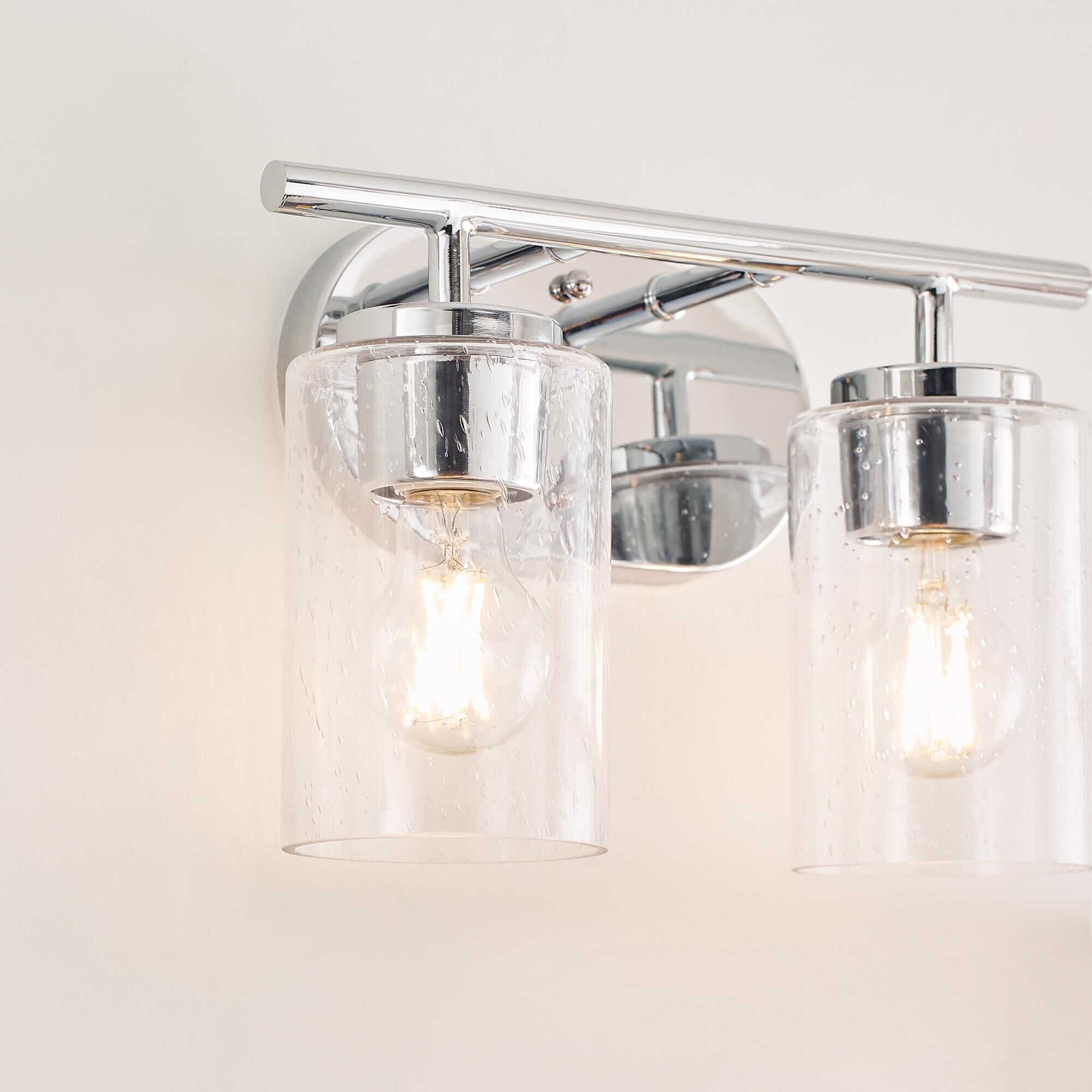 Shown in Chrome finish and Clear Seeded glass