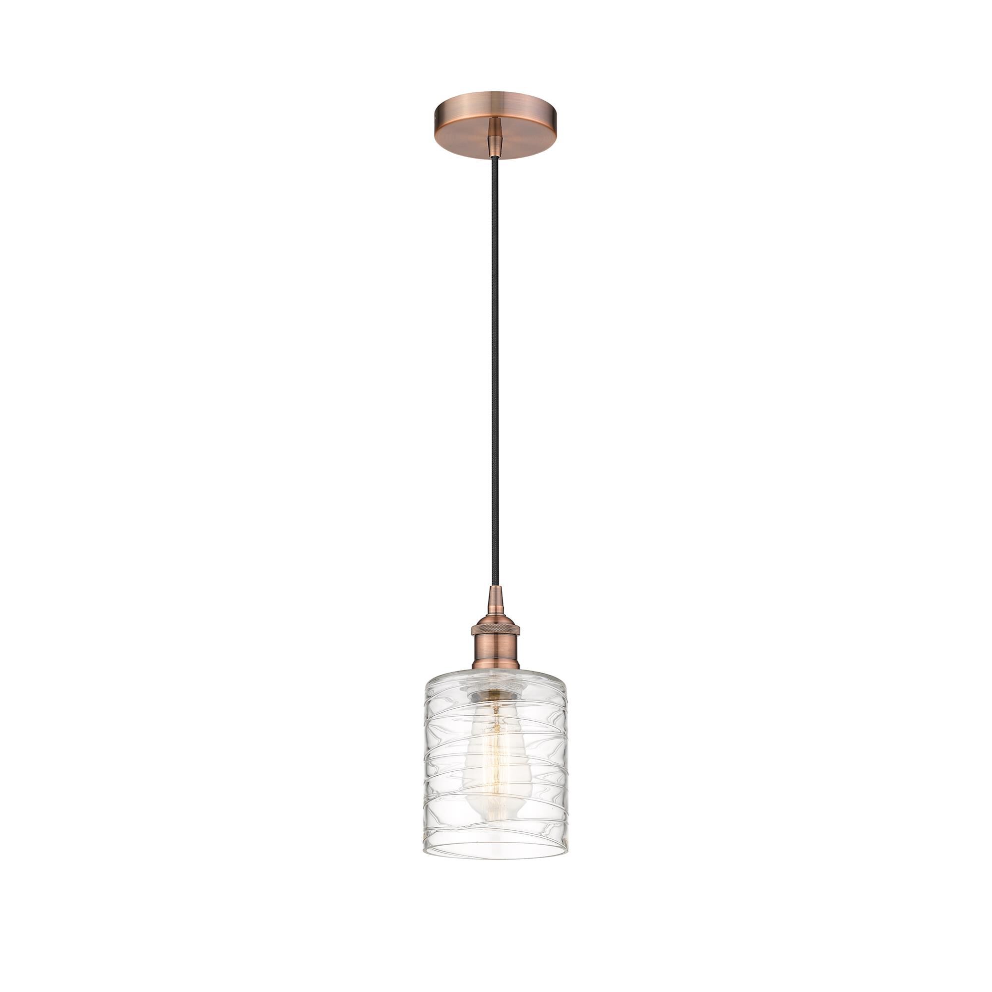 Shown in Antique Copper finish and Deco Swirl glass