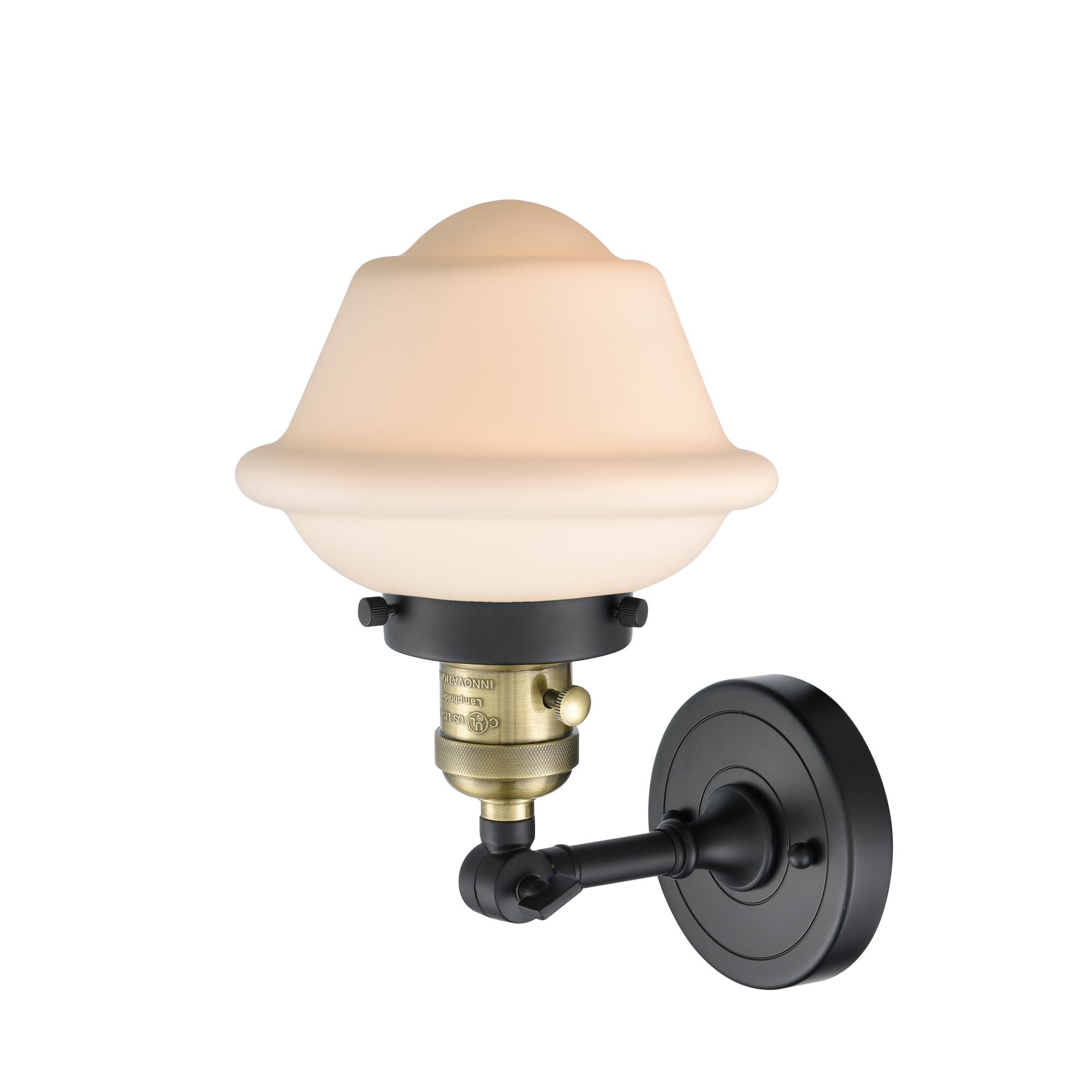 Shown in Black Antique Brass finish and Matte White Cased glass and Switch on Socket accent