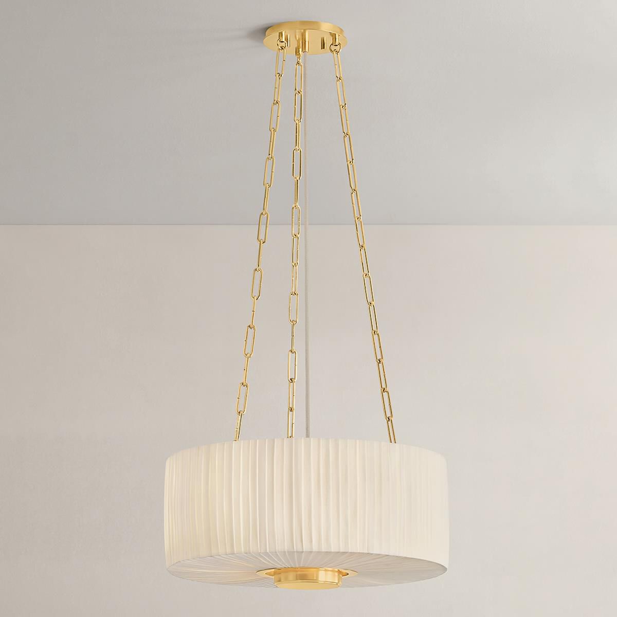 Shown in Aged Brass finish and Ivory Linen shade
