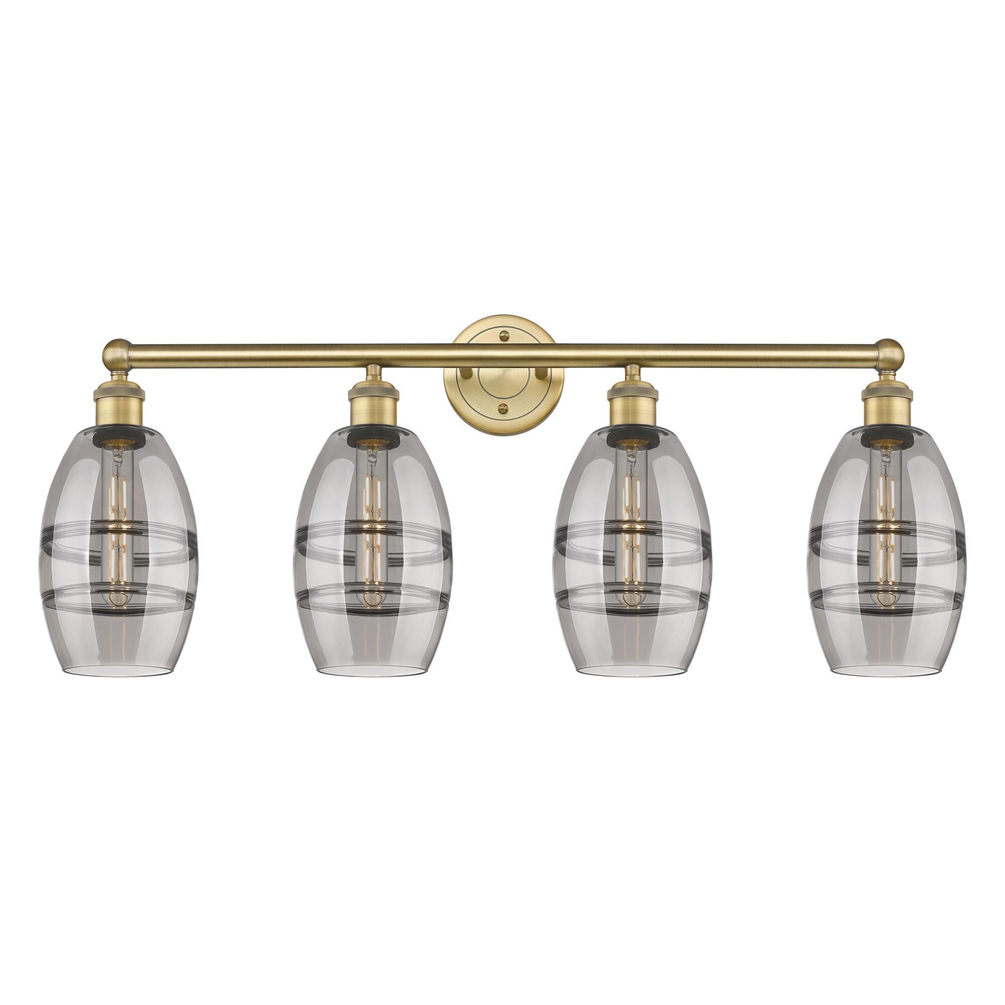 Shown in Brushed Brass finish and Light Smoke glass