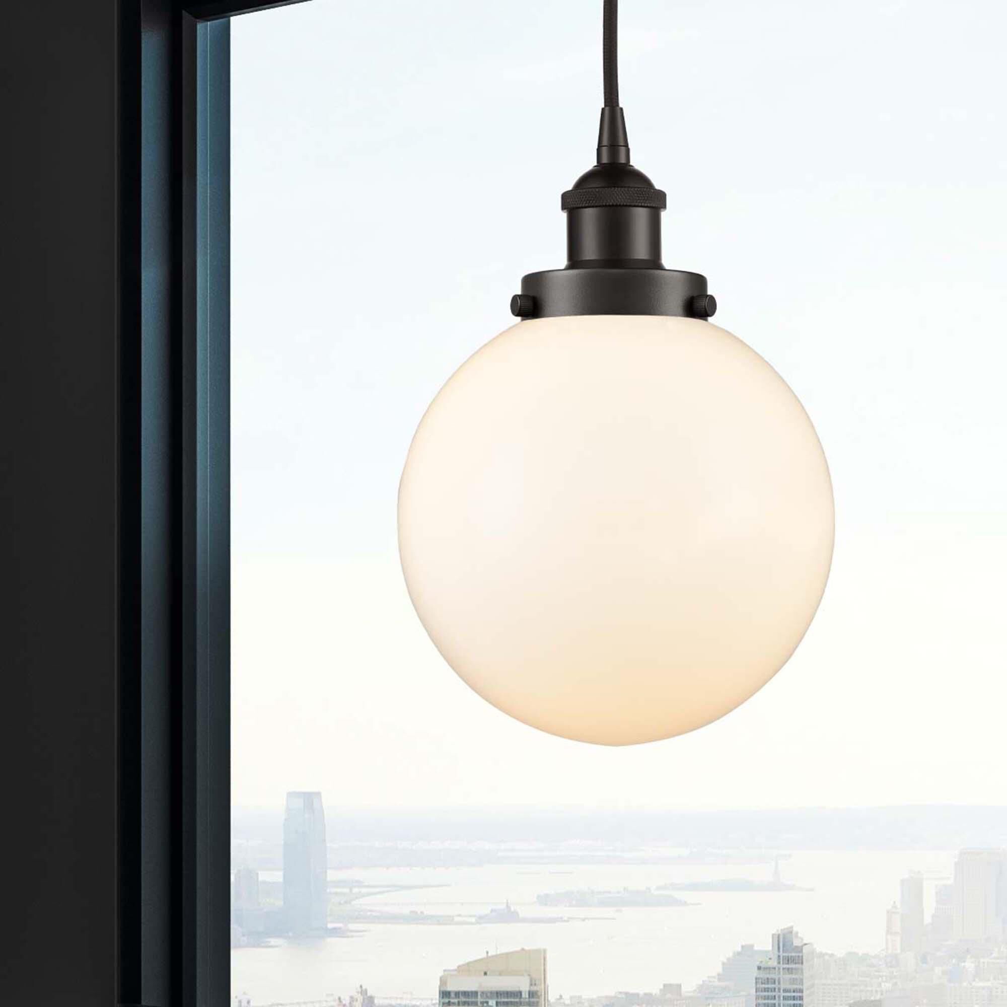 Shown in Oil Rubbed Bronze finish and Matte White Cased Beacon glass
