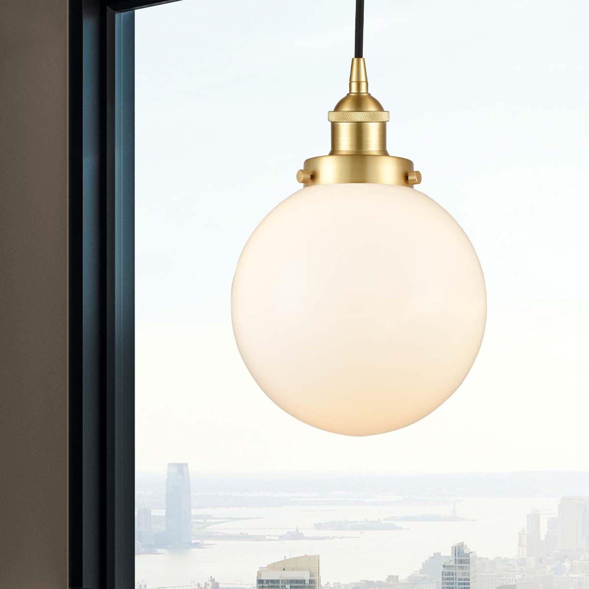 Shown in Satin Gold finish and Matte White Cased Beacon glass