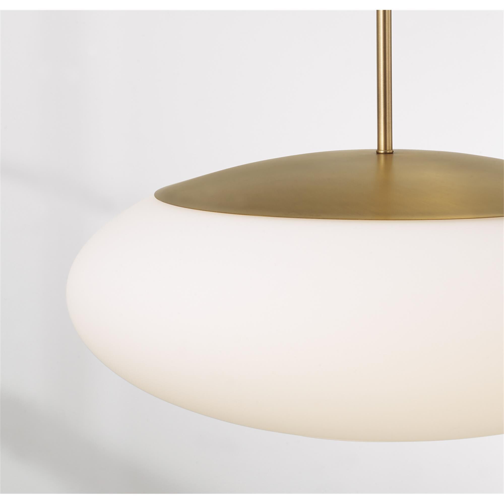 Shown in Aged Brass finish and Soft White glass