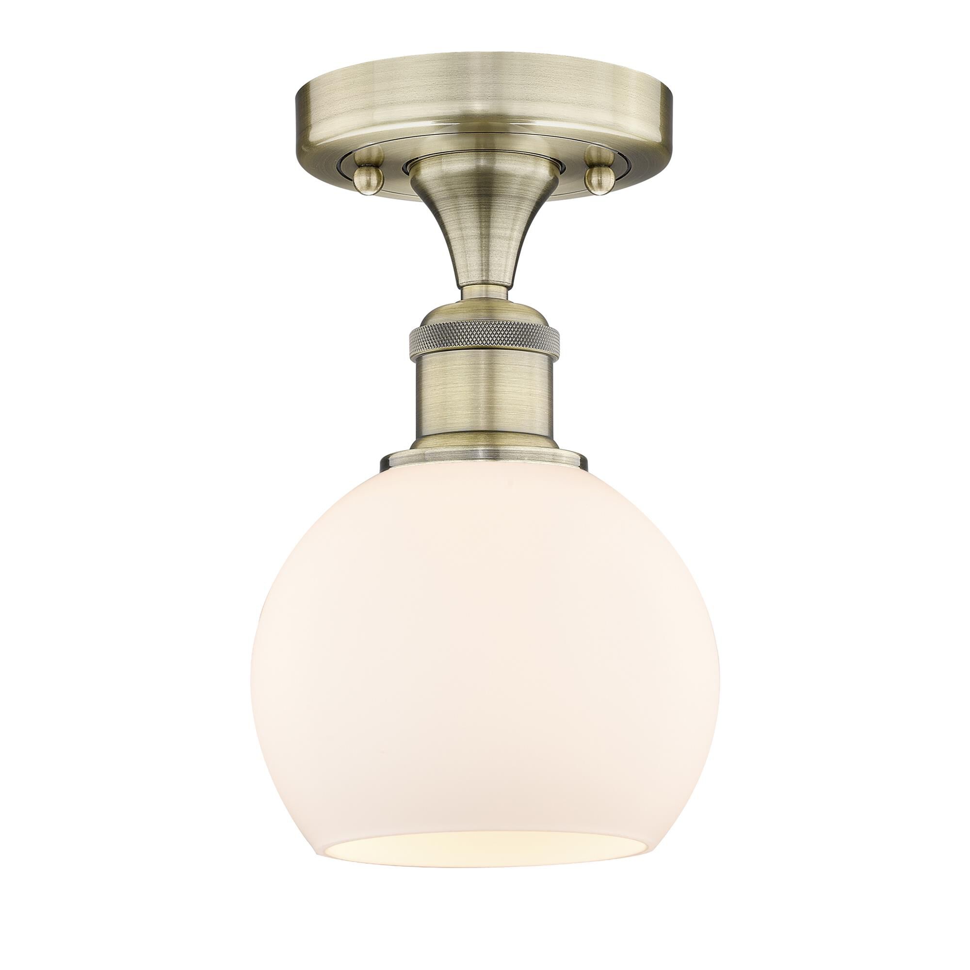 Shown in Antique Brass finish and Matte White glass