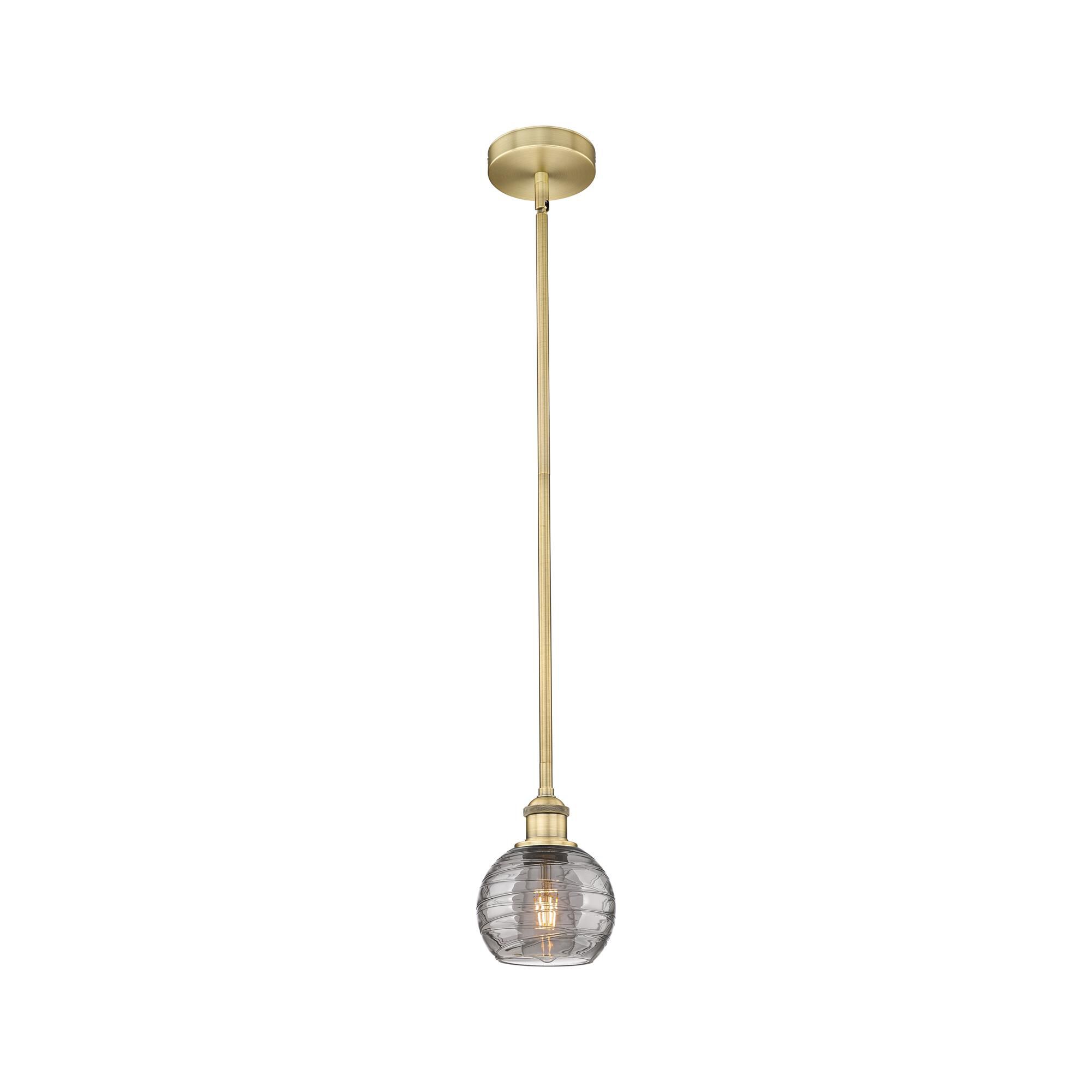 Shown in Brushed Brass finish and Light Smoke Deco Swirl glass