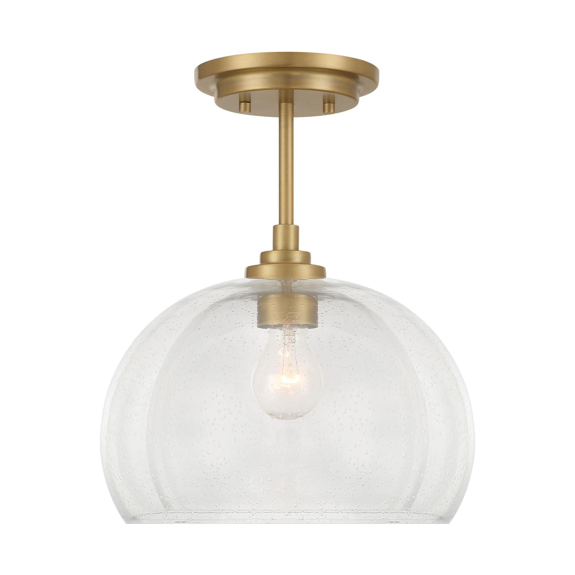 Shown in Legacy Brass finish and Clear And Seeded shade