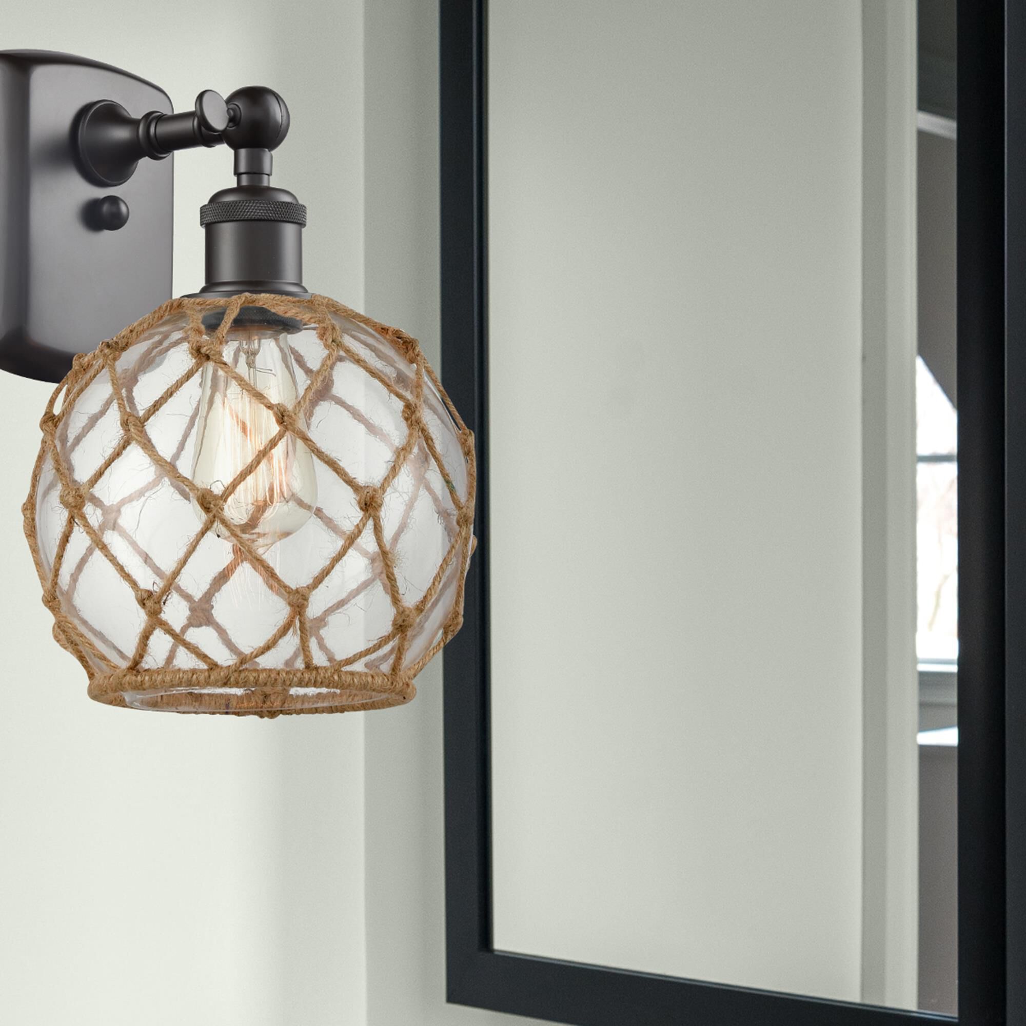 Shown in Oil Rubbed Bronze finish and Clear With Black Rope glass