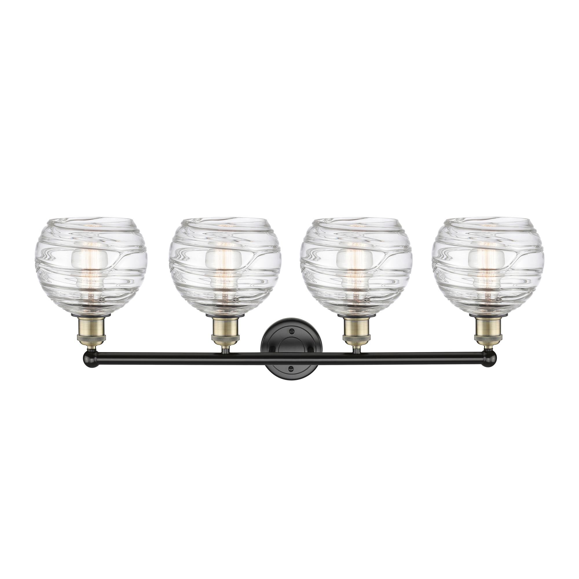 Shown in Black Antique Brass finish and Clear Deco Swirl glass