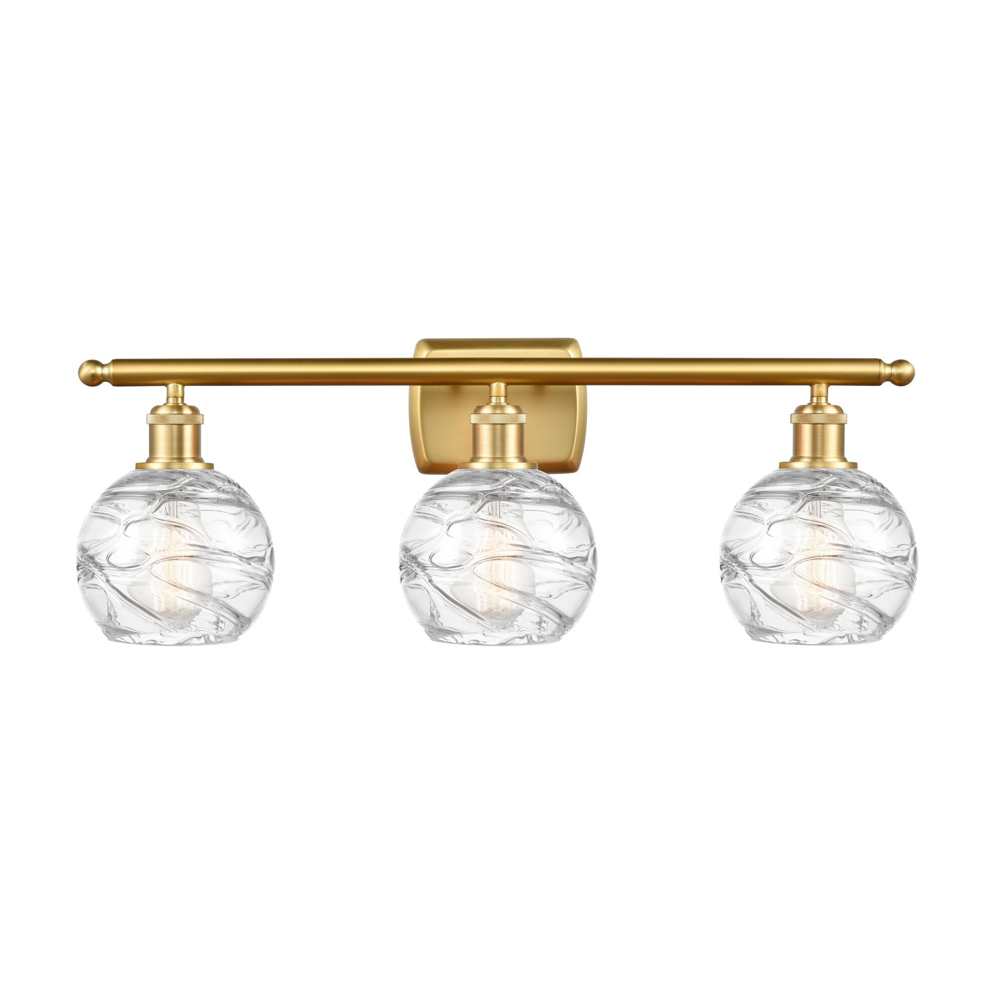Shown in Satin Gold finish and Clear Small Deco Swirl glass