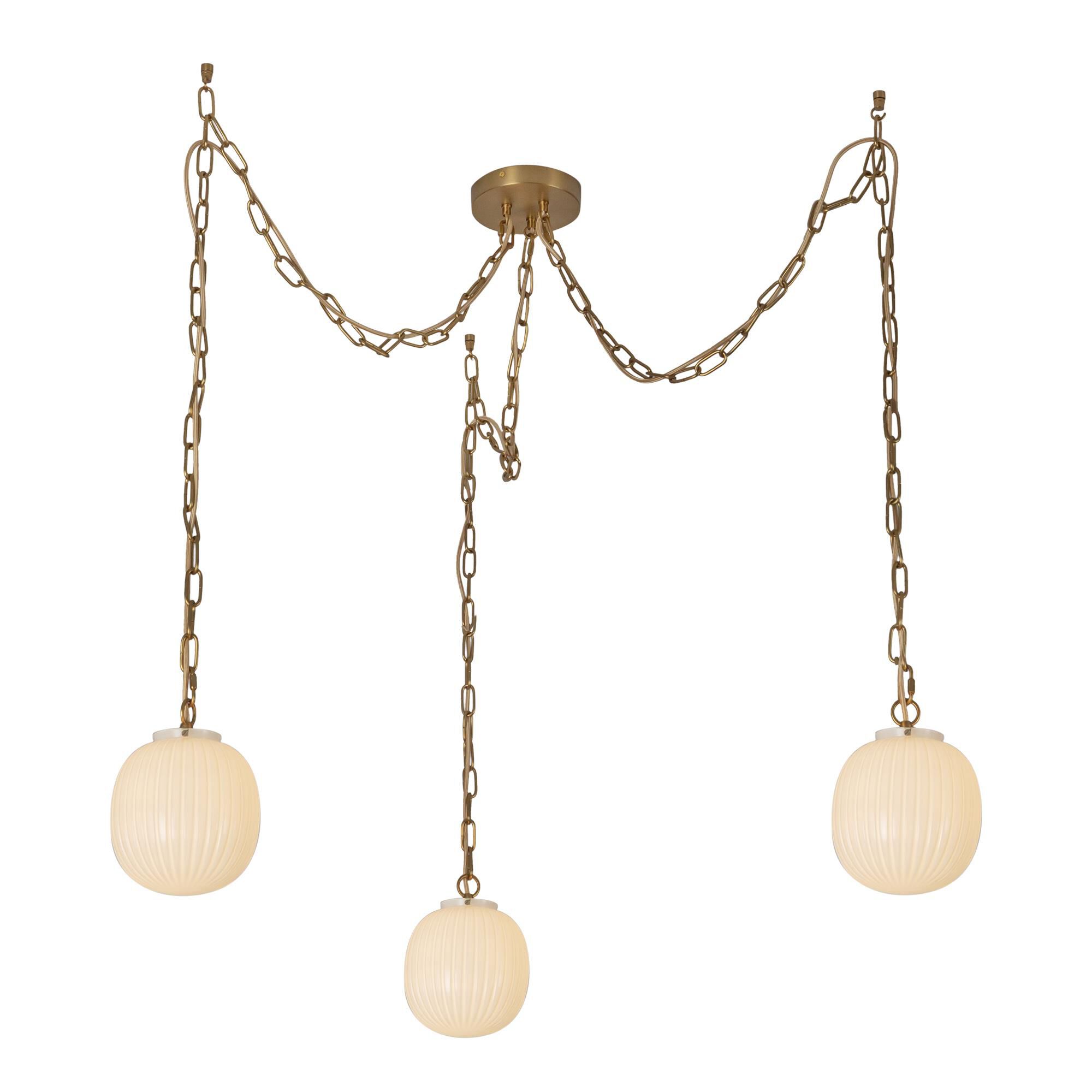 Shown in Brushed Gold finish and Glossy Ribbed Opal glass
