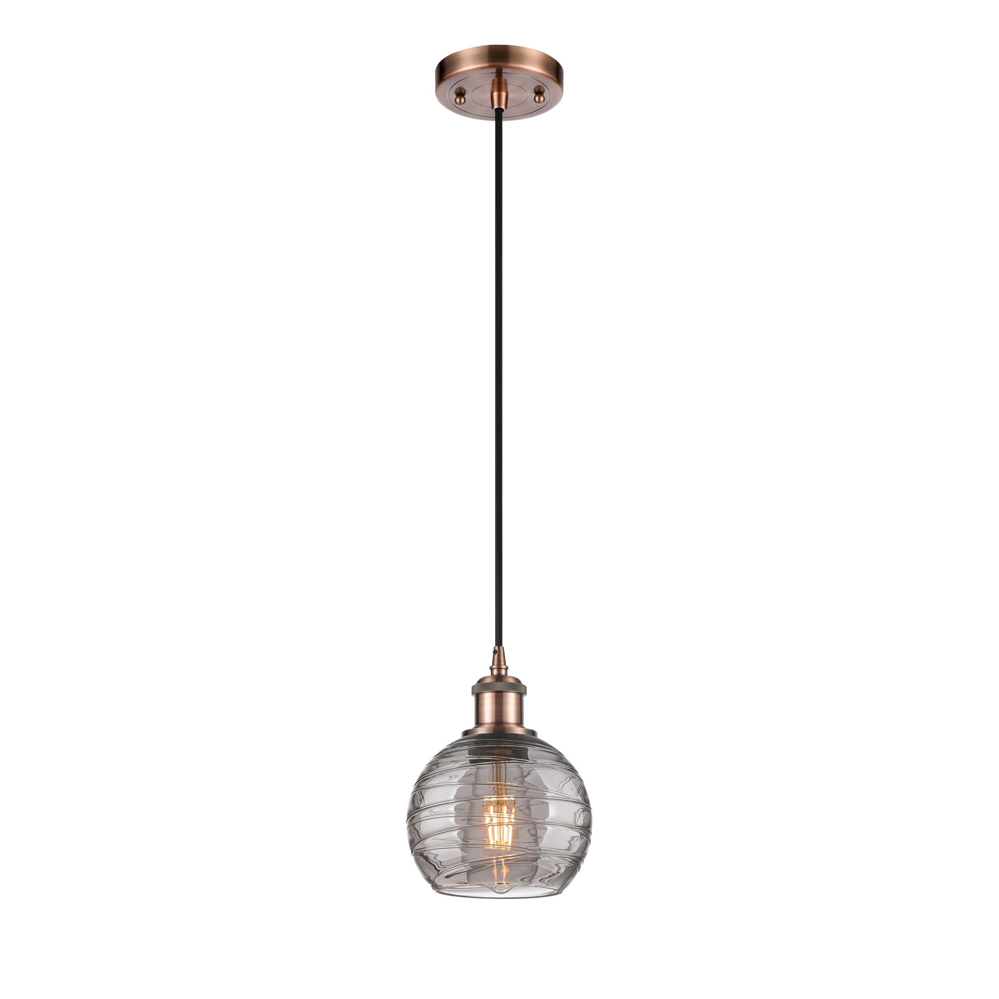 Shown in Antique Copper finish and Light Smoke Deco Swirl glass