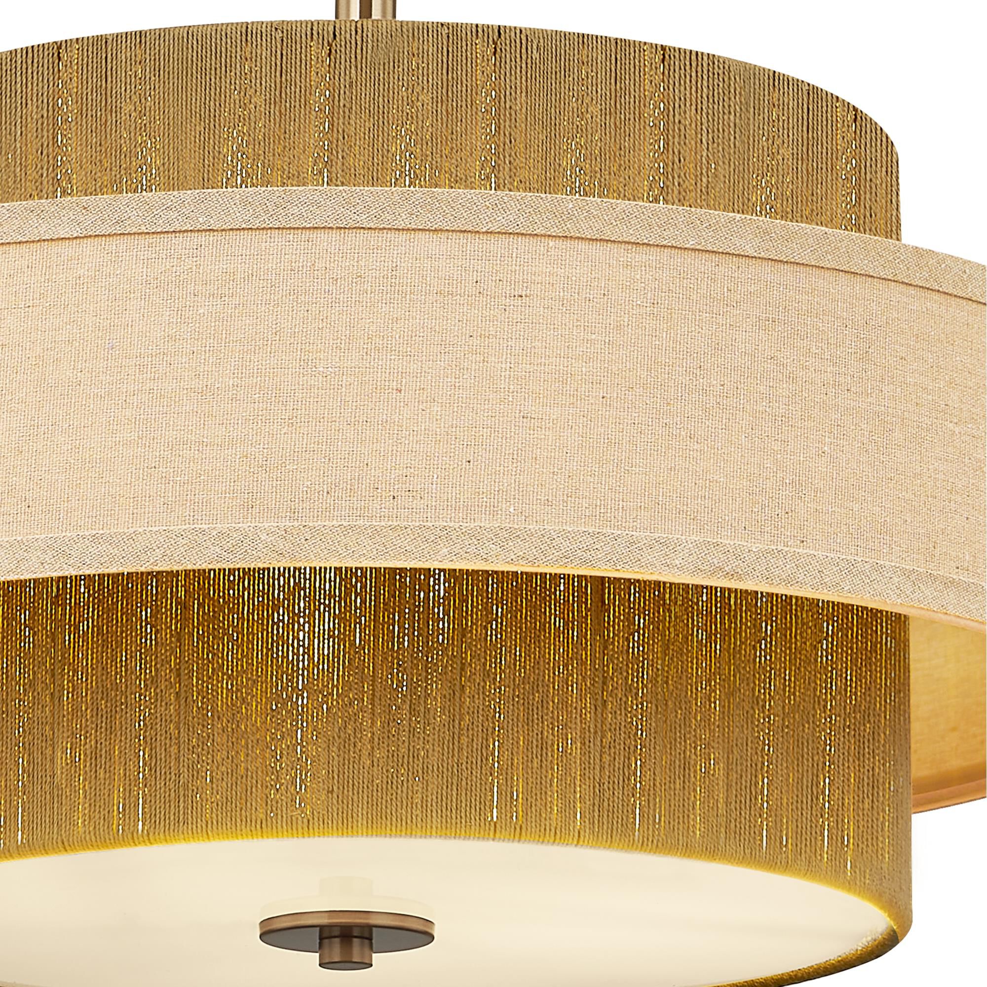 Shown in Brushed Brass finish and Cream Linen shade