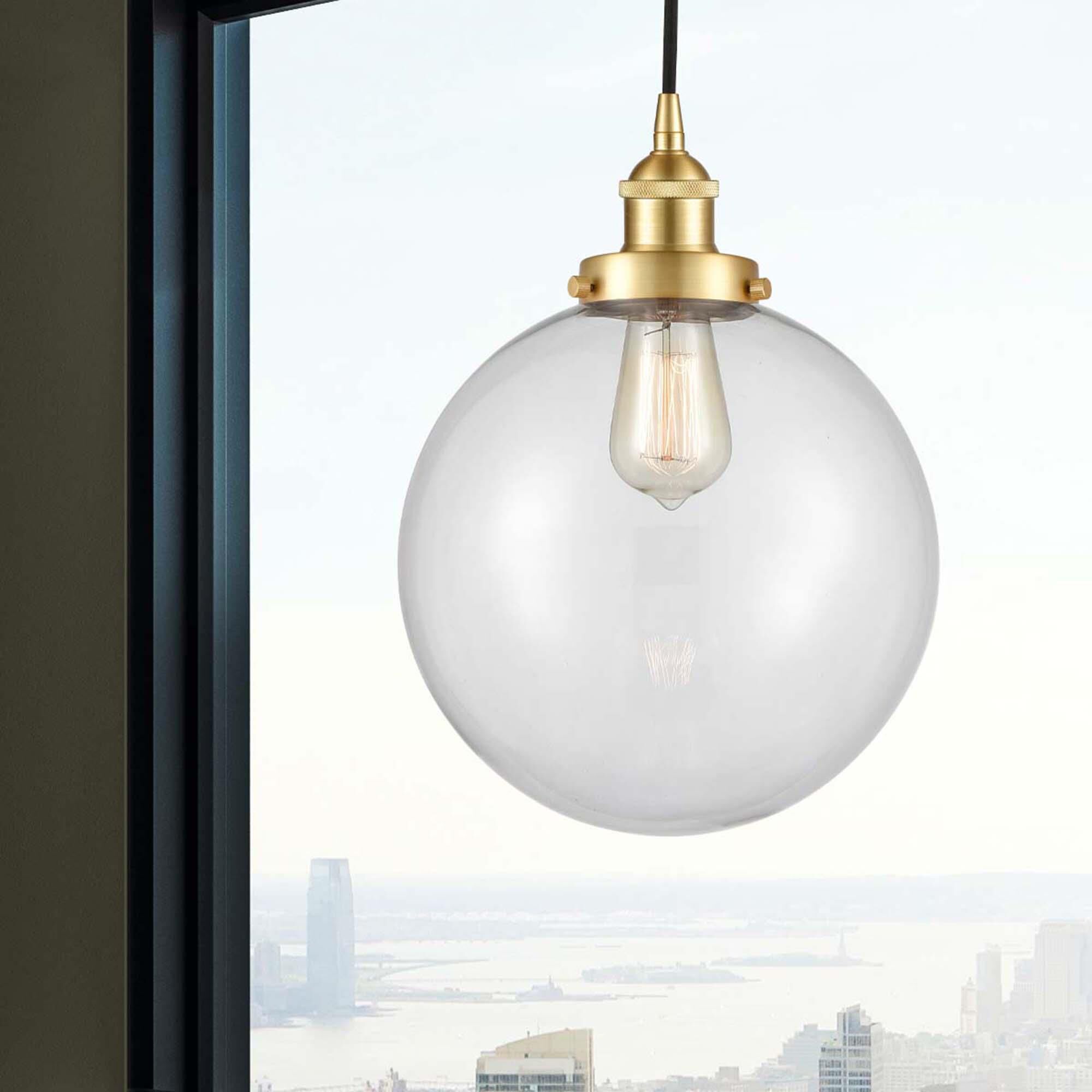 Shown in Satin Gold finish and Clear Beacon glass