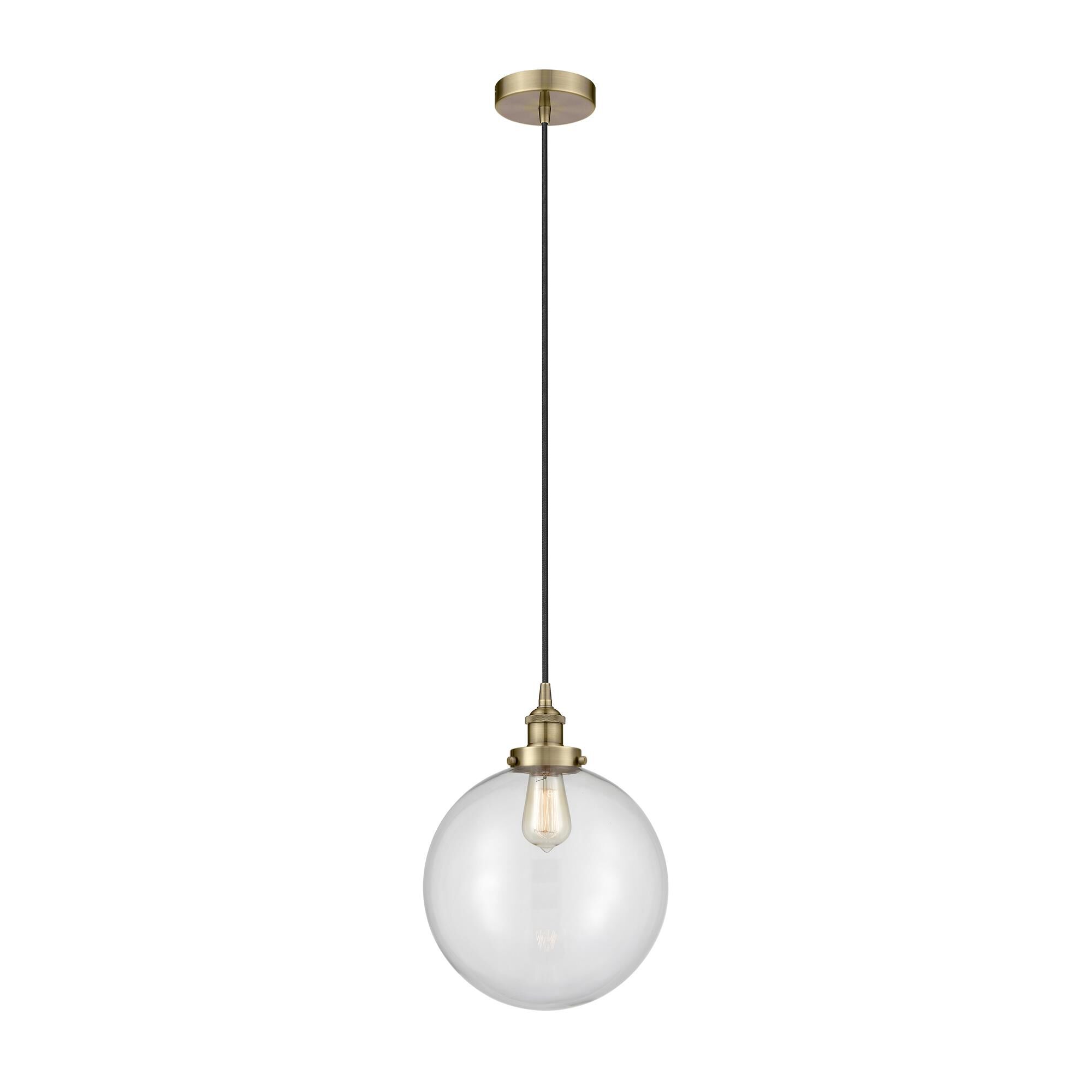 Shown in Antique Brass finish and Clear Beacon glass