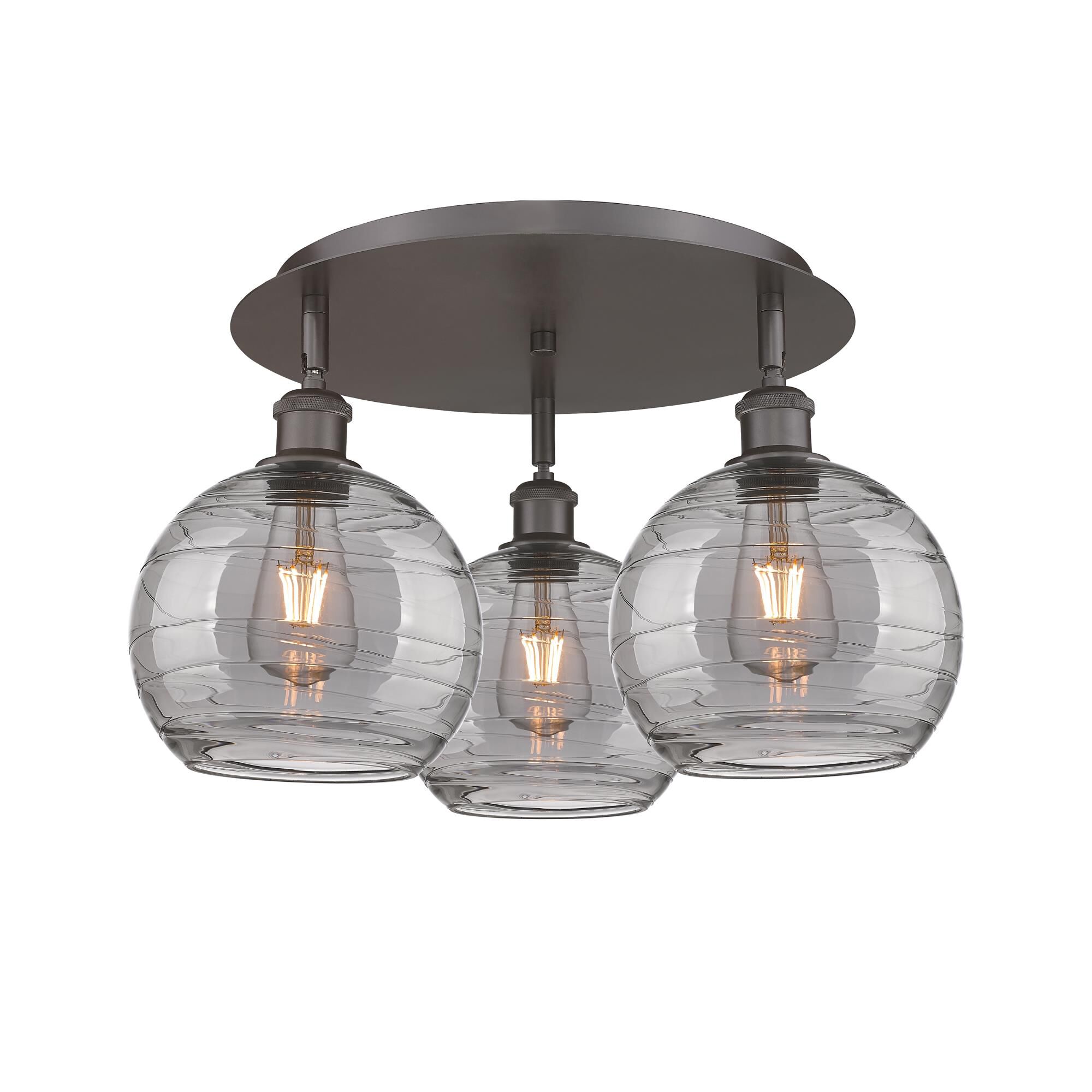 Shown in Oil Rubbed Bronze finish and Light Smoke Deco Swirl glass