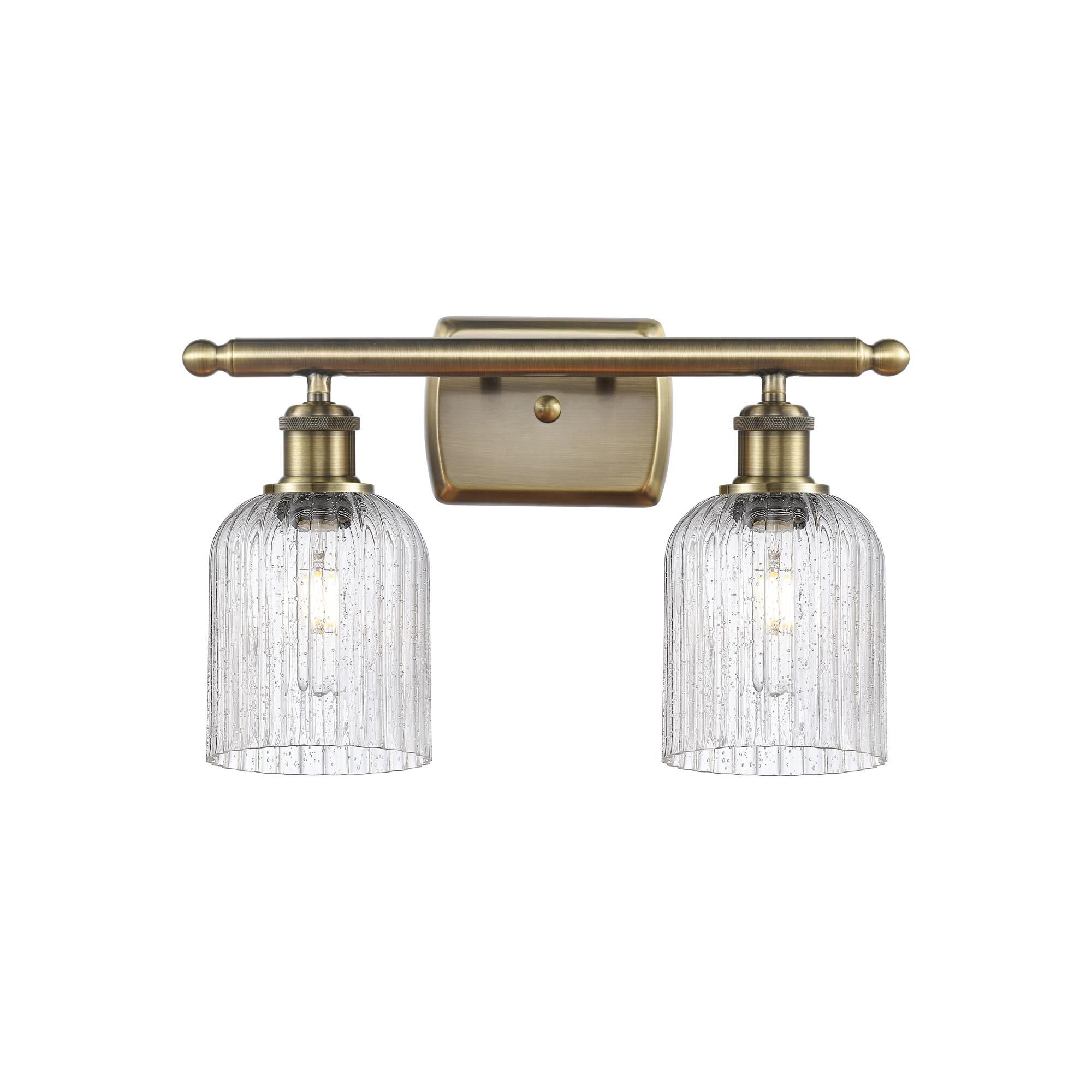 Shown in Antique Brass finish and Seedy shade