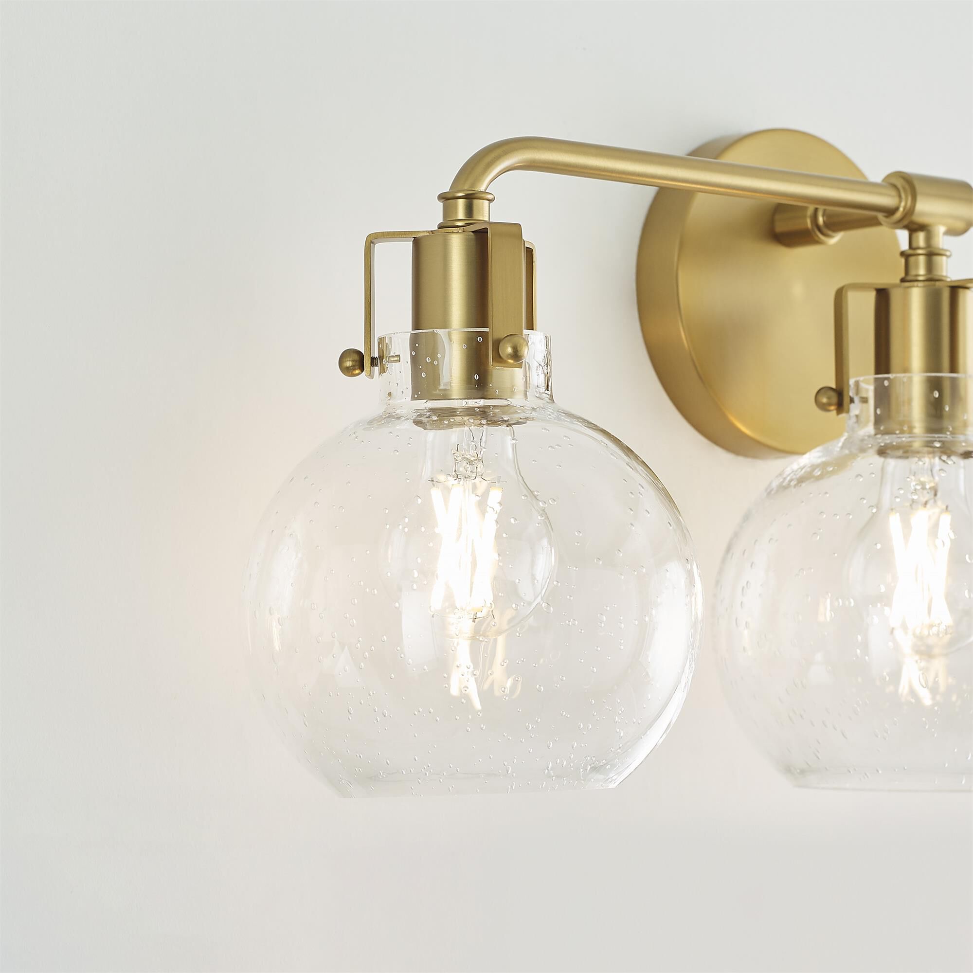 Shown in Burnished Brass finish and Clear Seeded glass