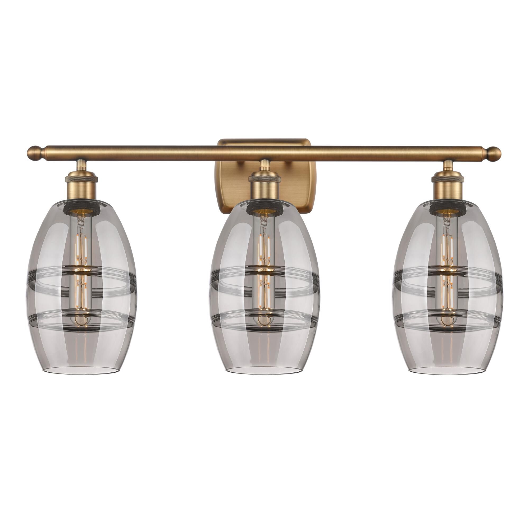 Shown in Brushed Brass finish and Light Smoke glass