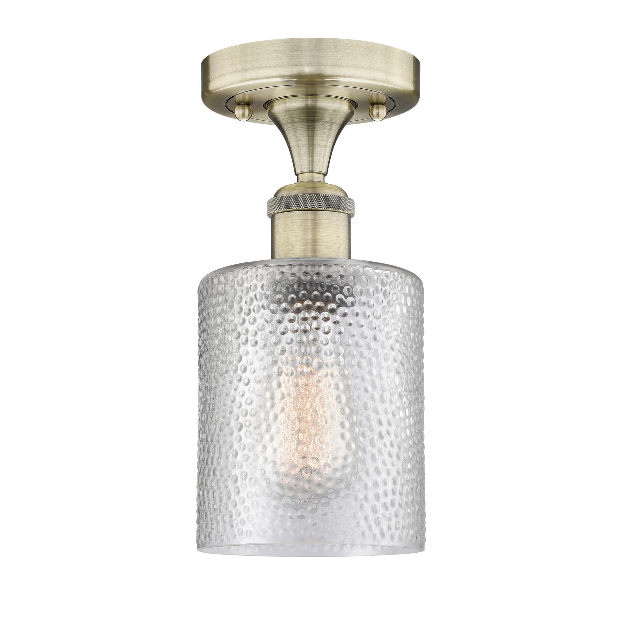 Shown in Antique Brass finish and Clear glass