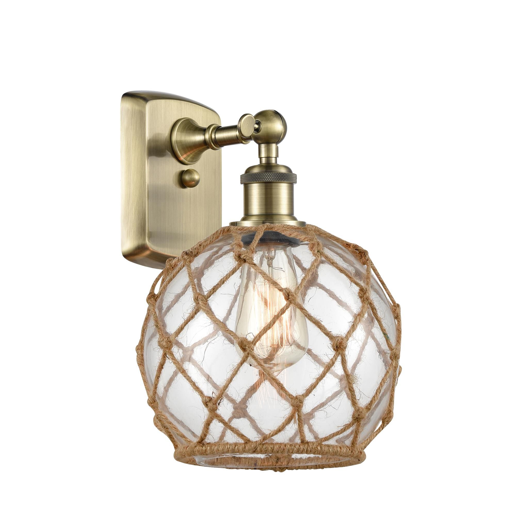 Shown in Antique Brass finish and Sphere glass and Glass And Rope shade