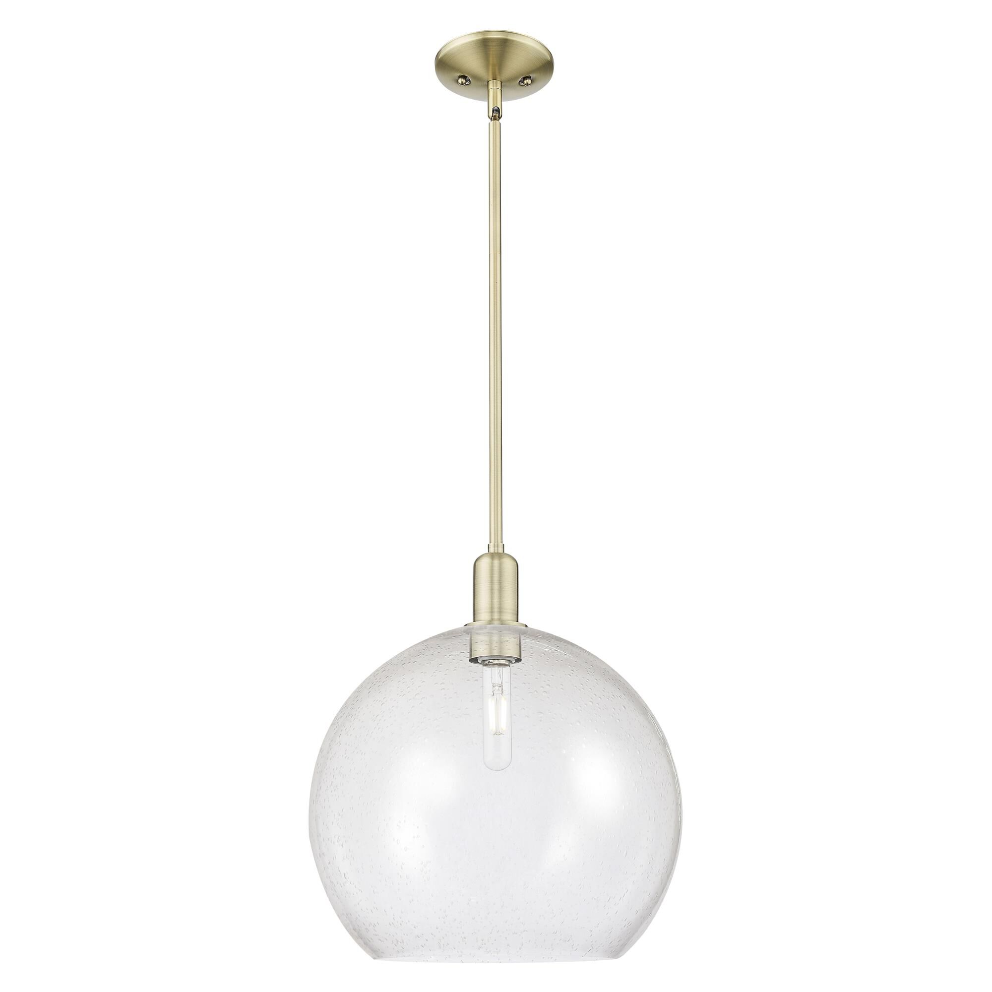 Shown in Antique Brass finish and Seedy glass