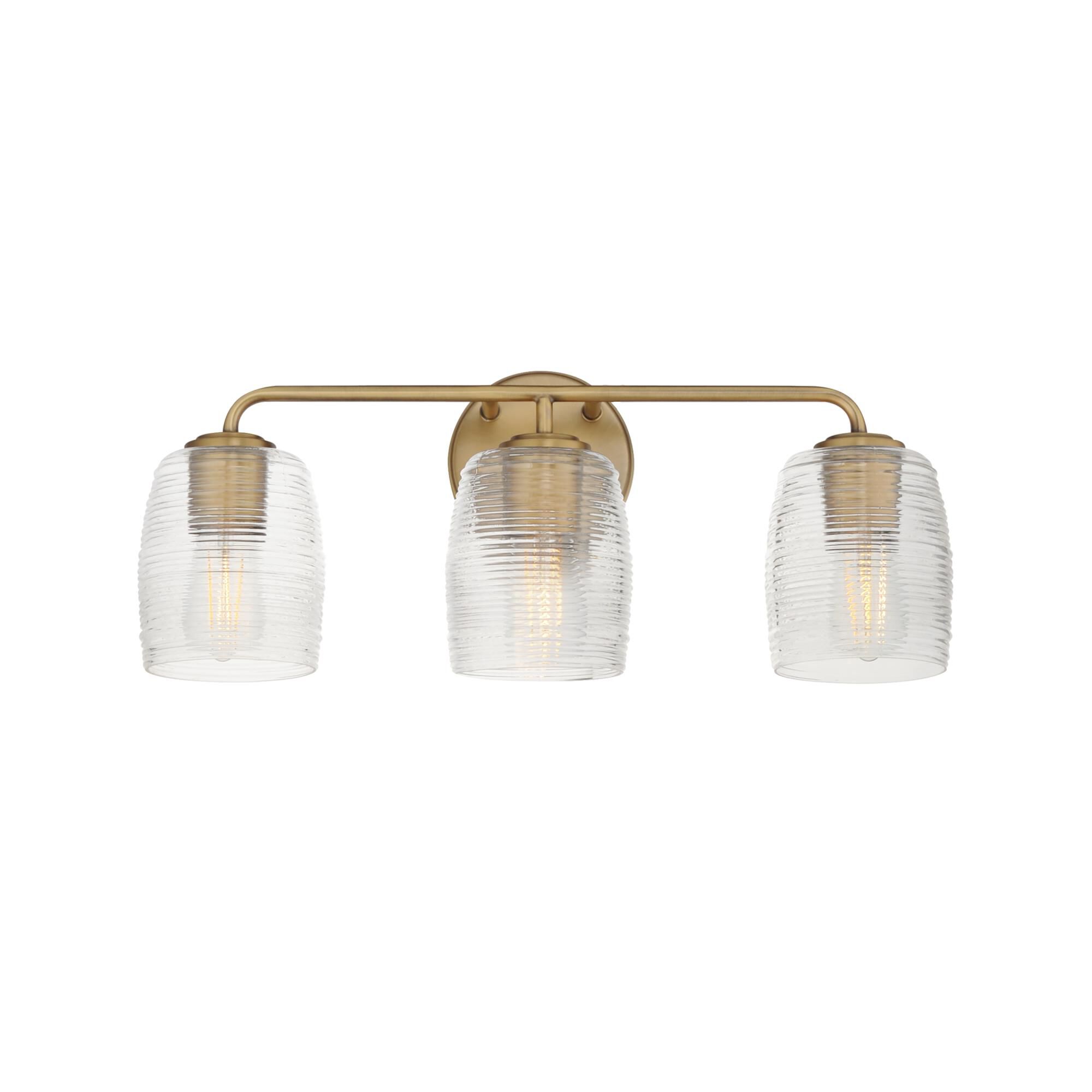 Shown in Natural Aged Brass finish and Clear Ribbed glass