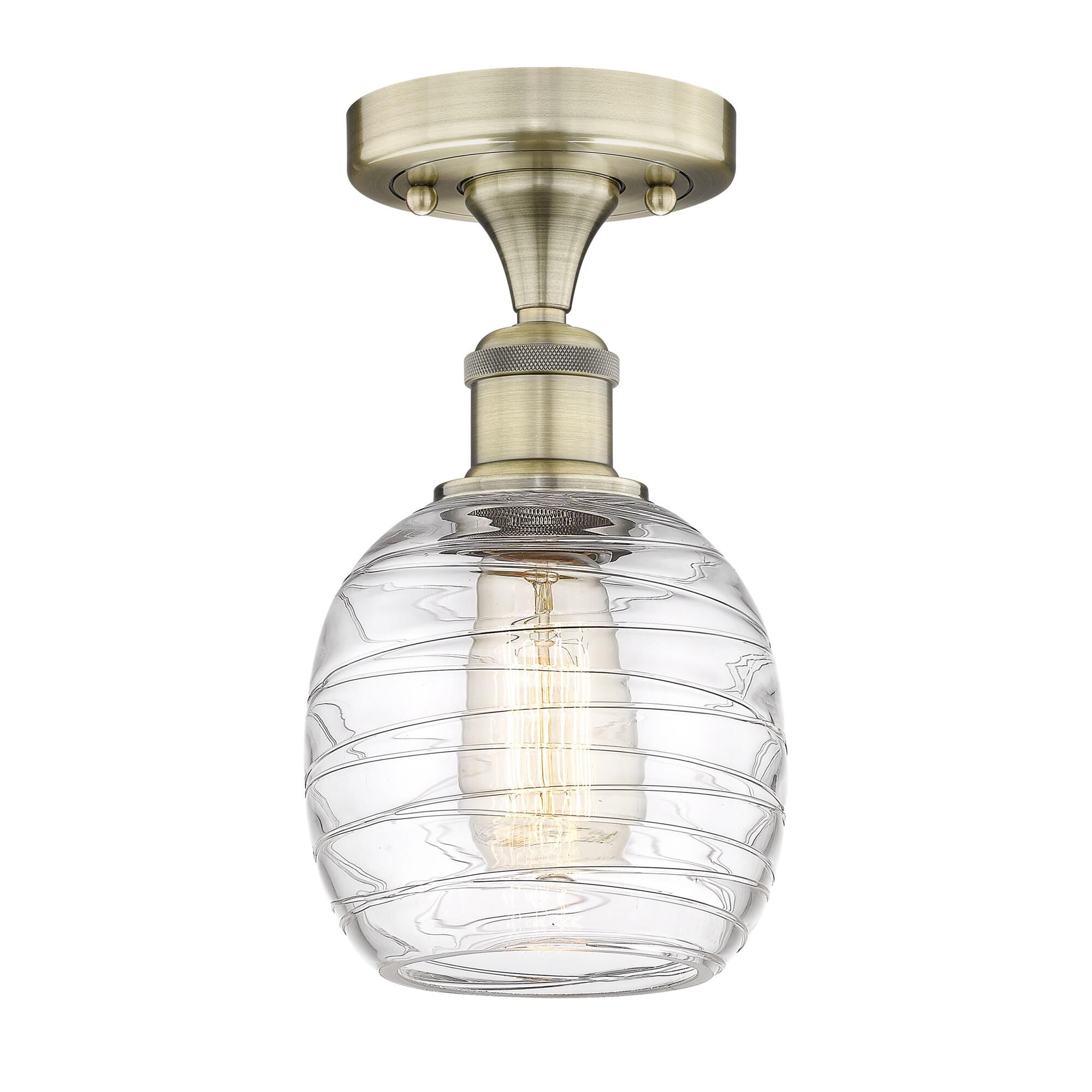 Shown in Antique Brass finish and Deco Swirl glass