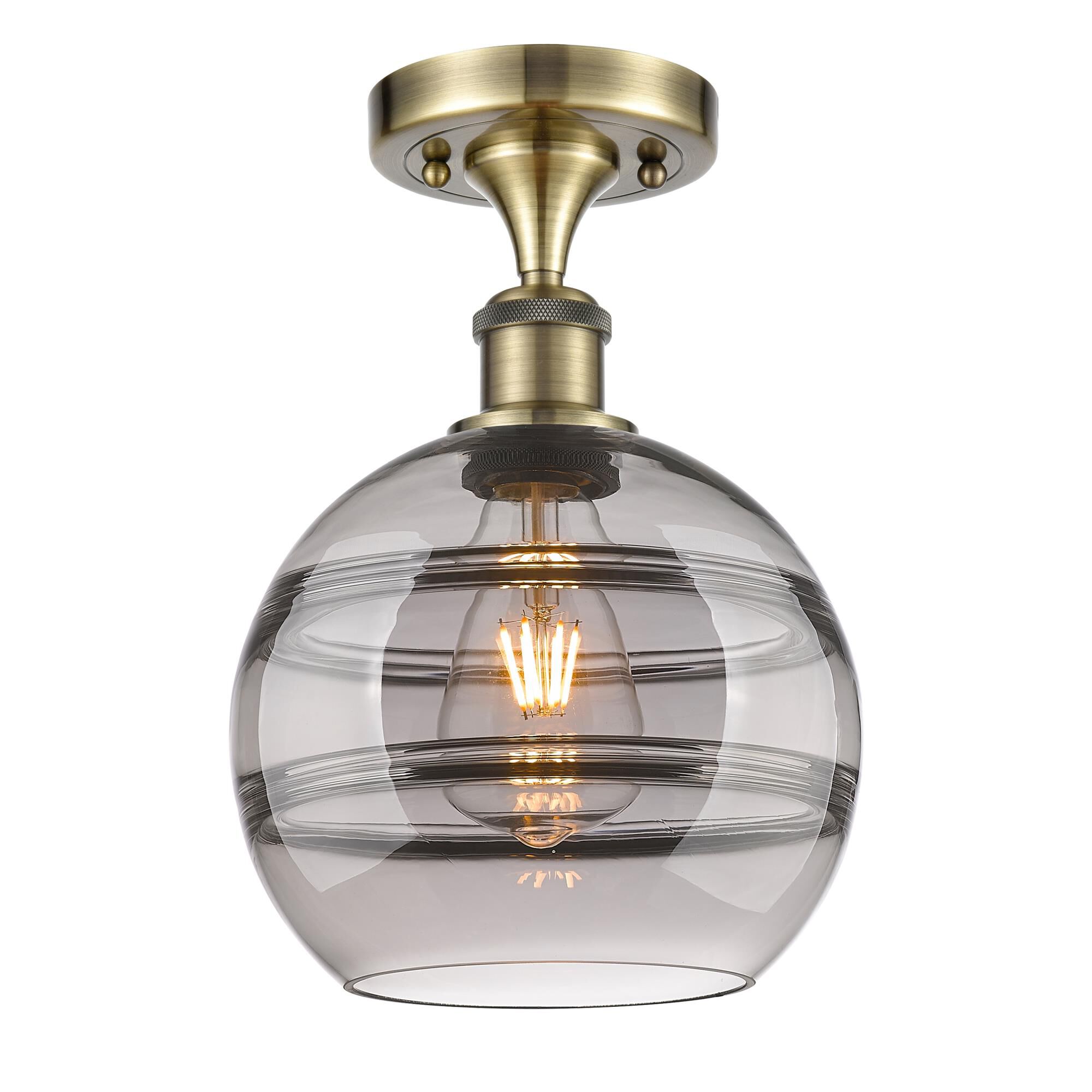 Shown in Antique Brass finish and Light Smoke glass