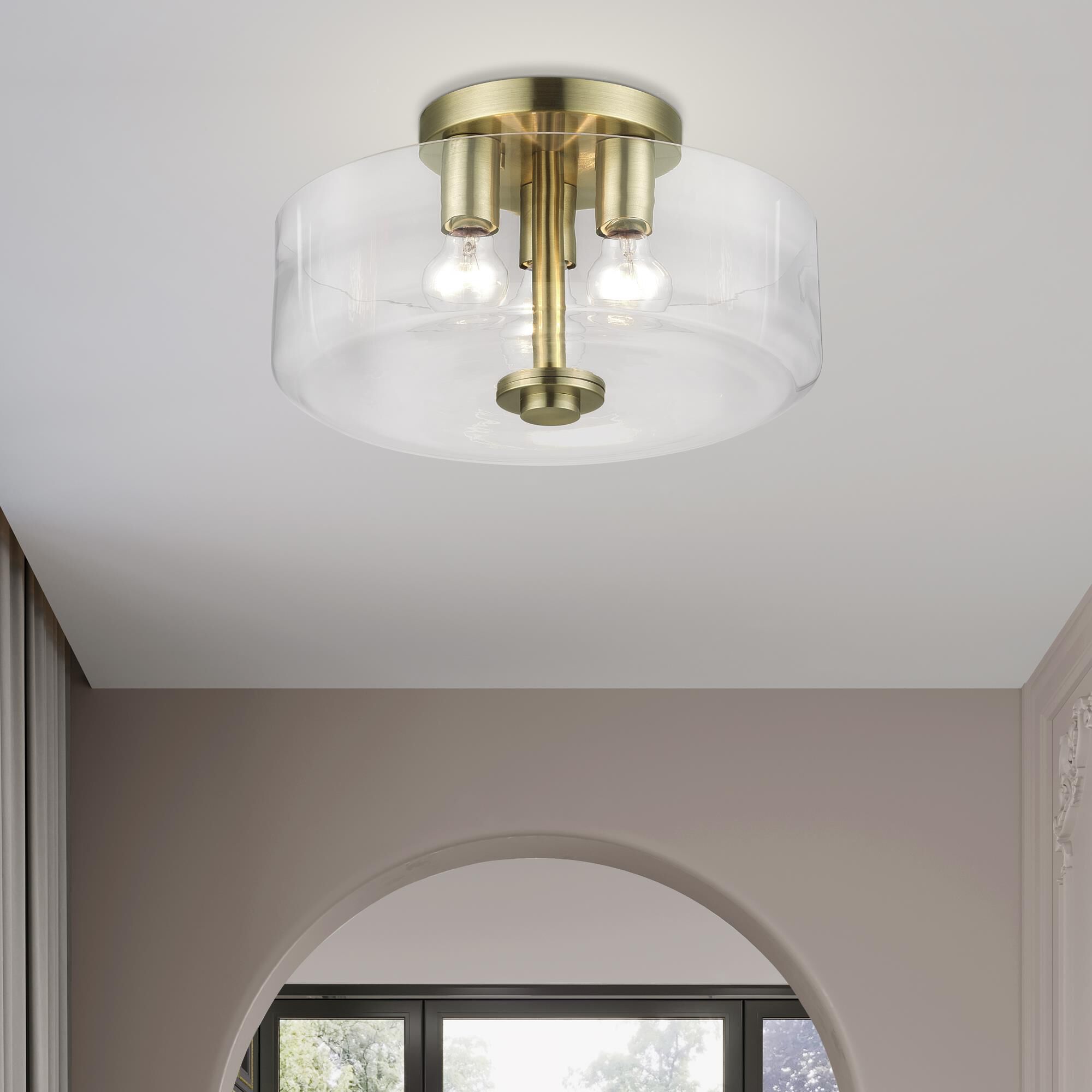 Shown in Antique Brass finish and Mouth Blown Clear glass