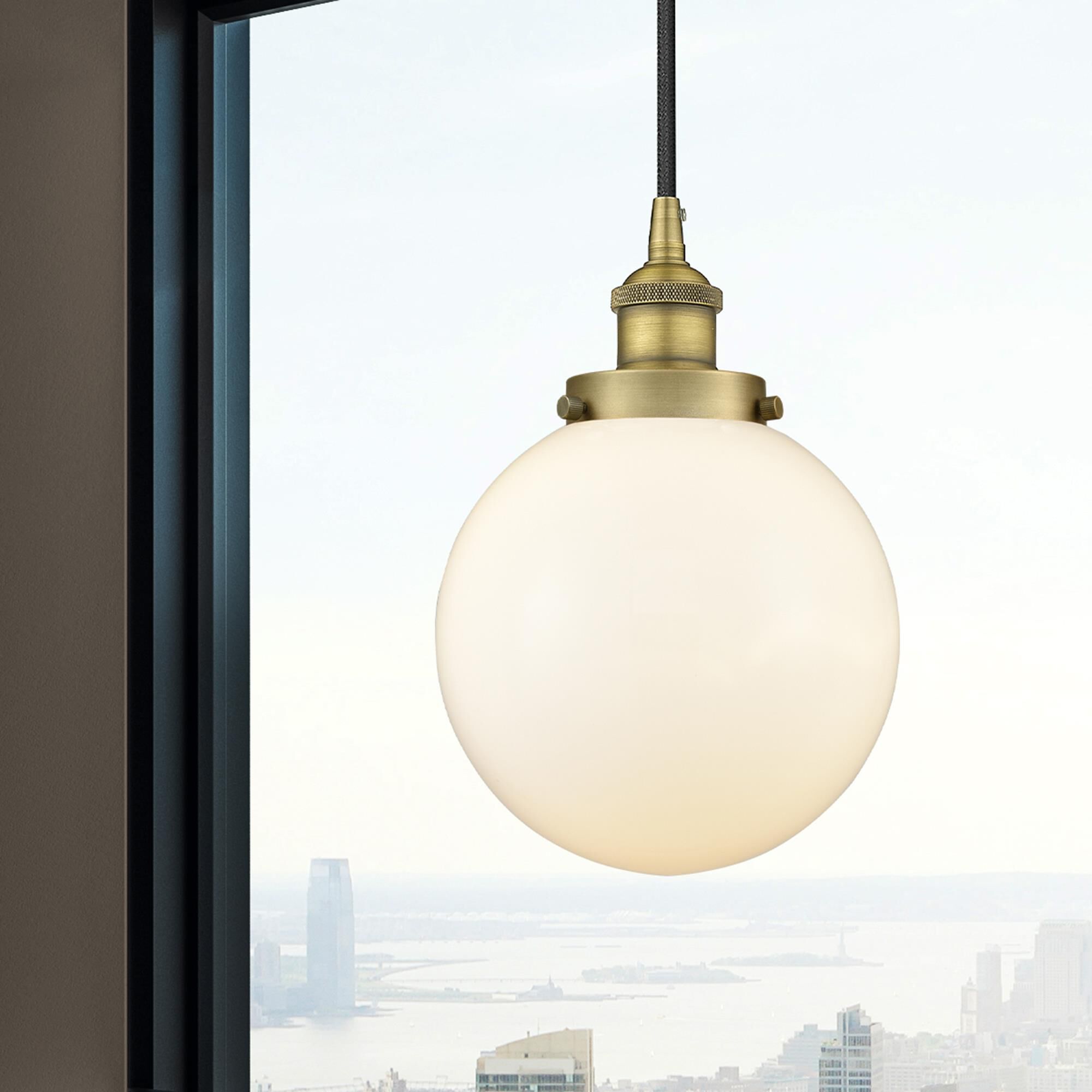 Shown in Brushed Brass finish and Matte White Cased Beacon glass
