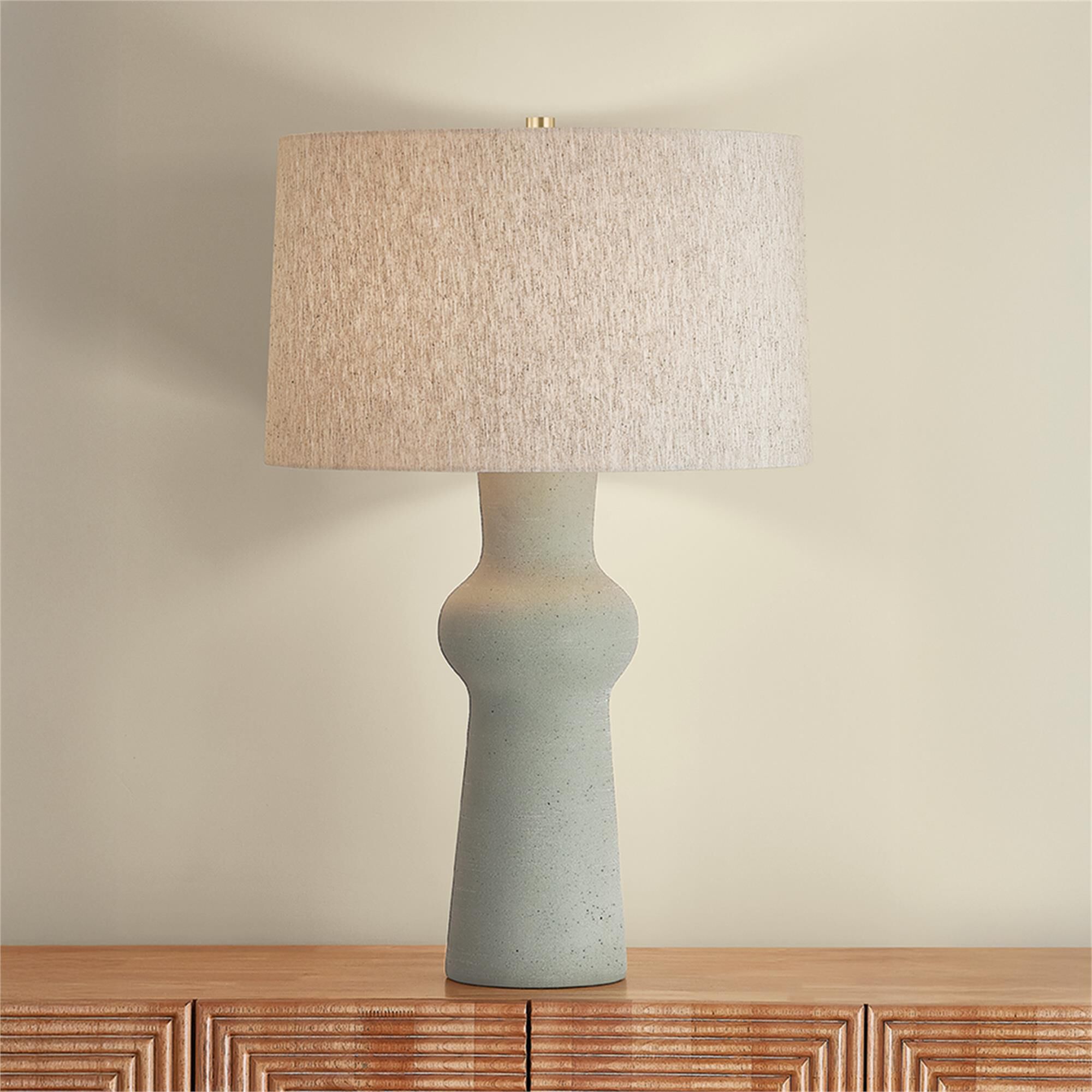 Shown in Aged Brass and Ceramic Hazy Jade finish and Natural Linen shade