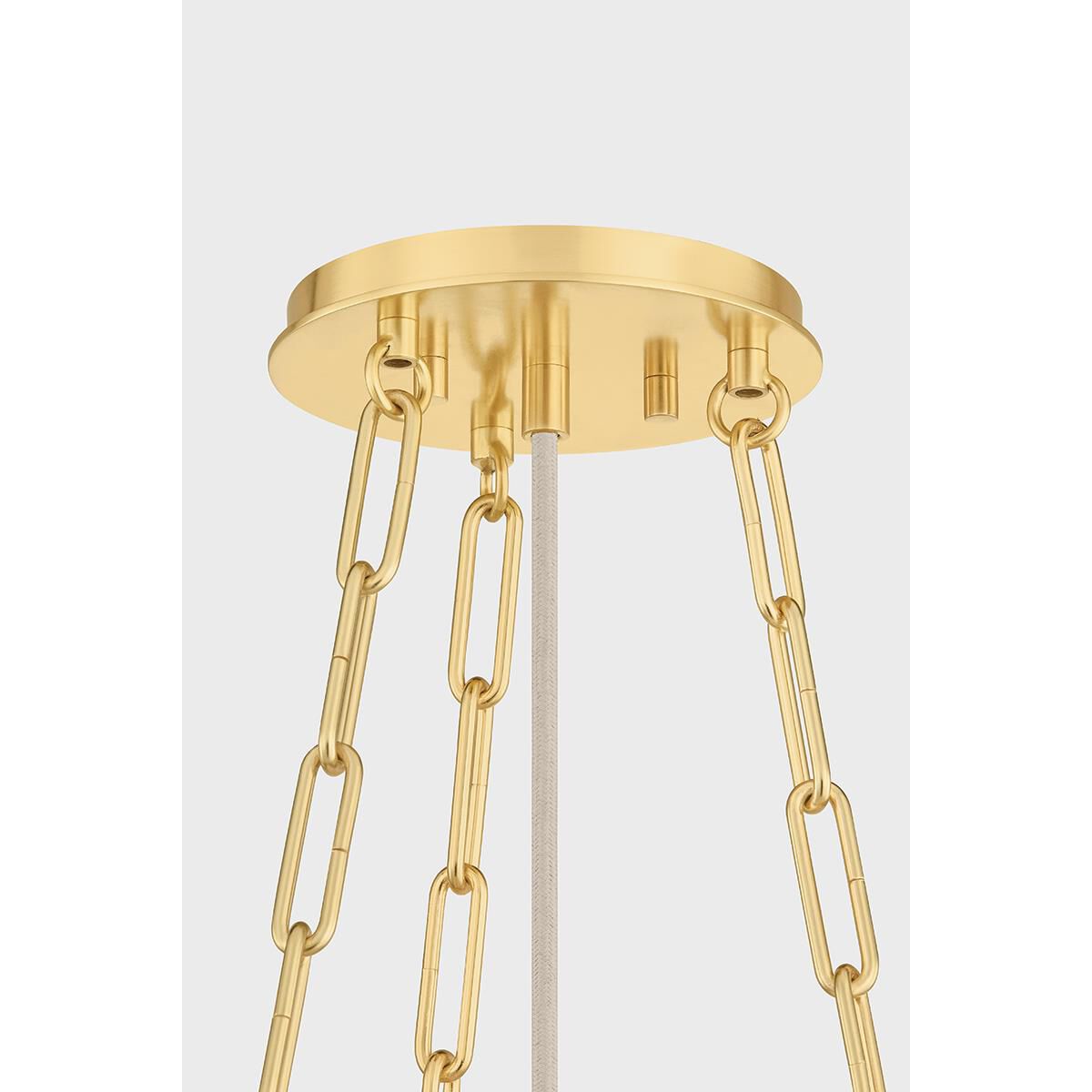 Shown in Aged Brass finish and Ivory Linen shade