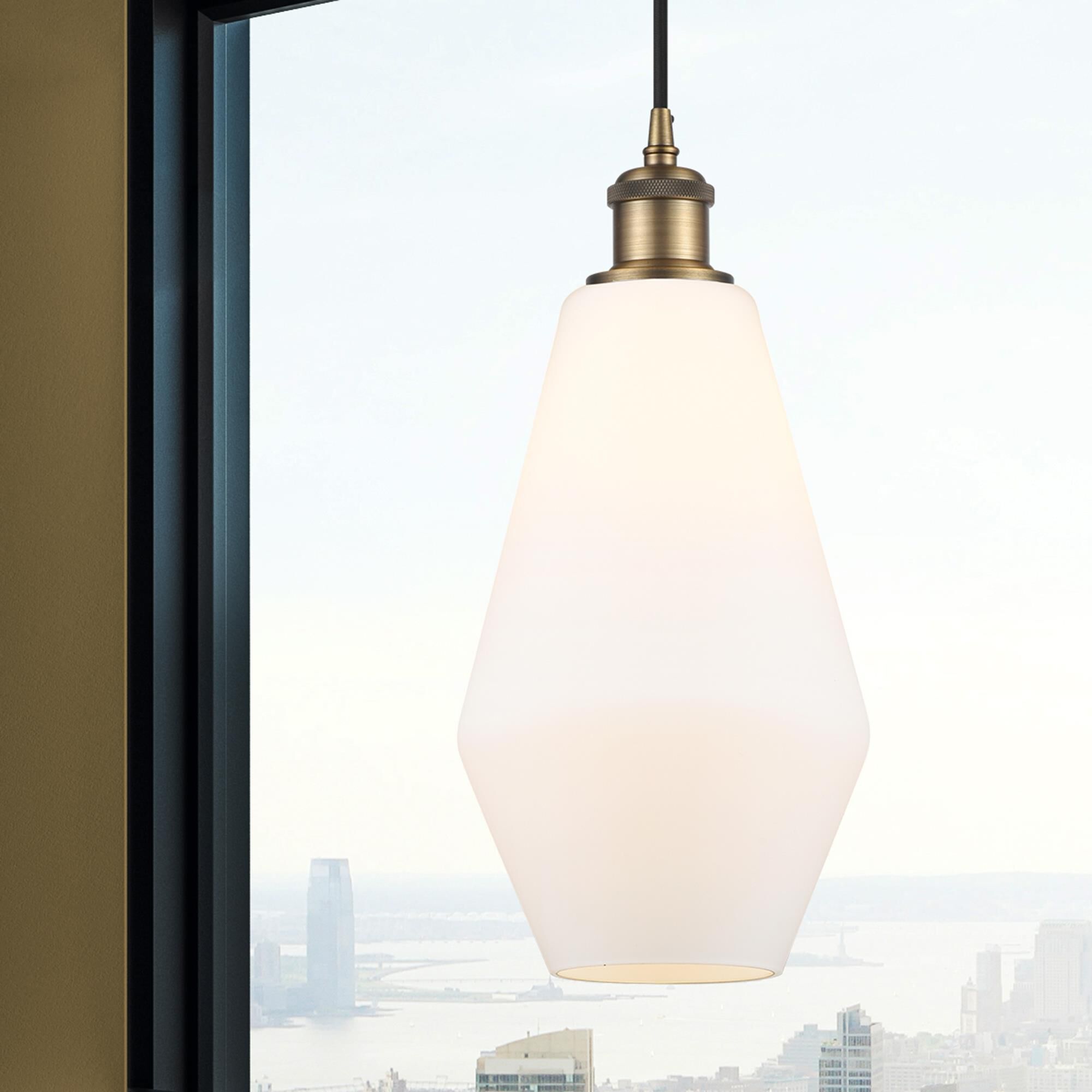 Shown in Brushed Brass finish and Matte White glass