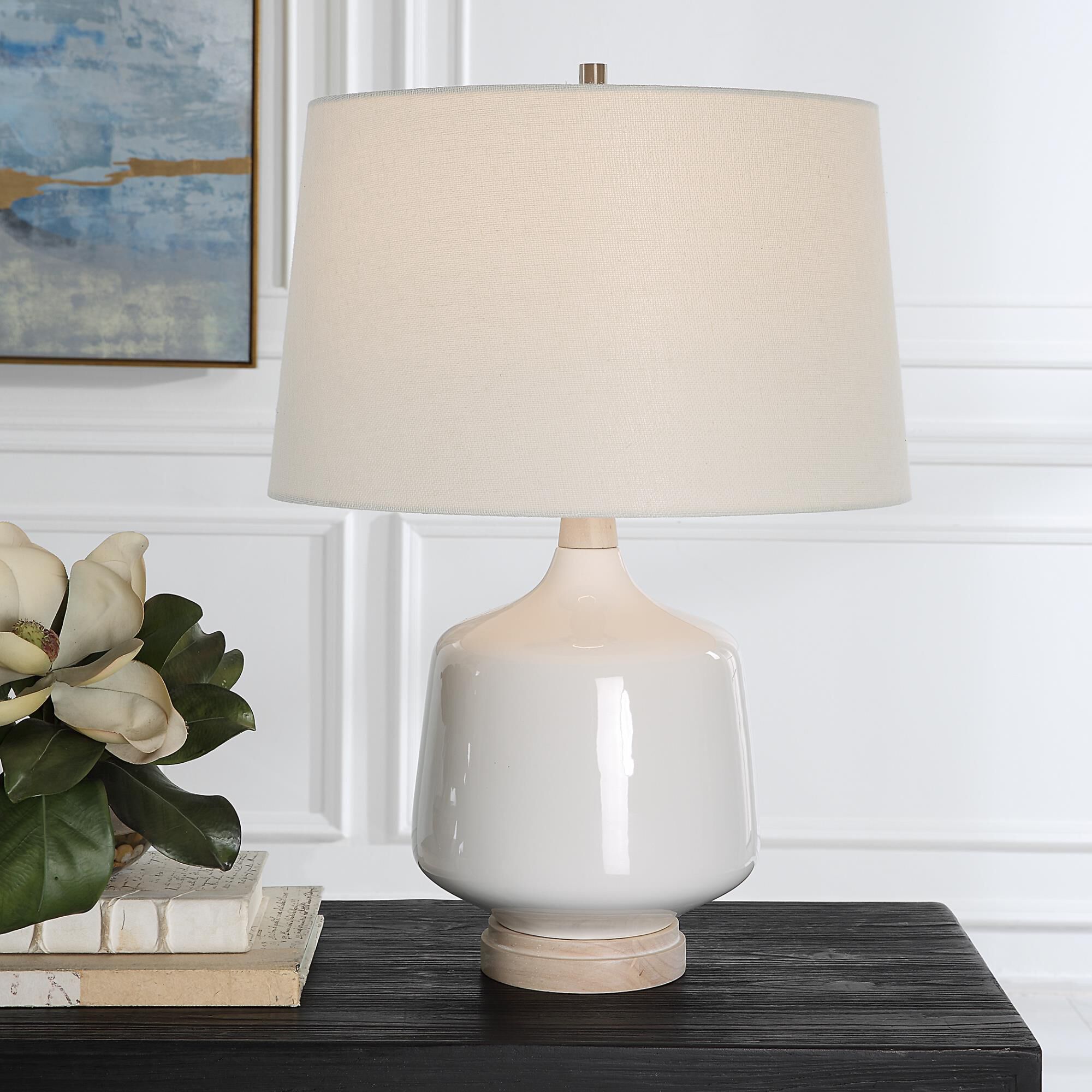 Shown in This Ceramic Table Lamp Featuring A White High Gloss Glaze Accented By Brushed Nickel Finishes. The  finish and Round Hardback shade
