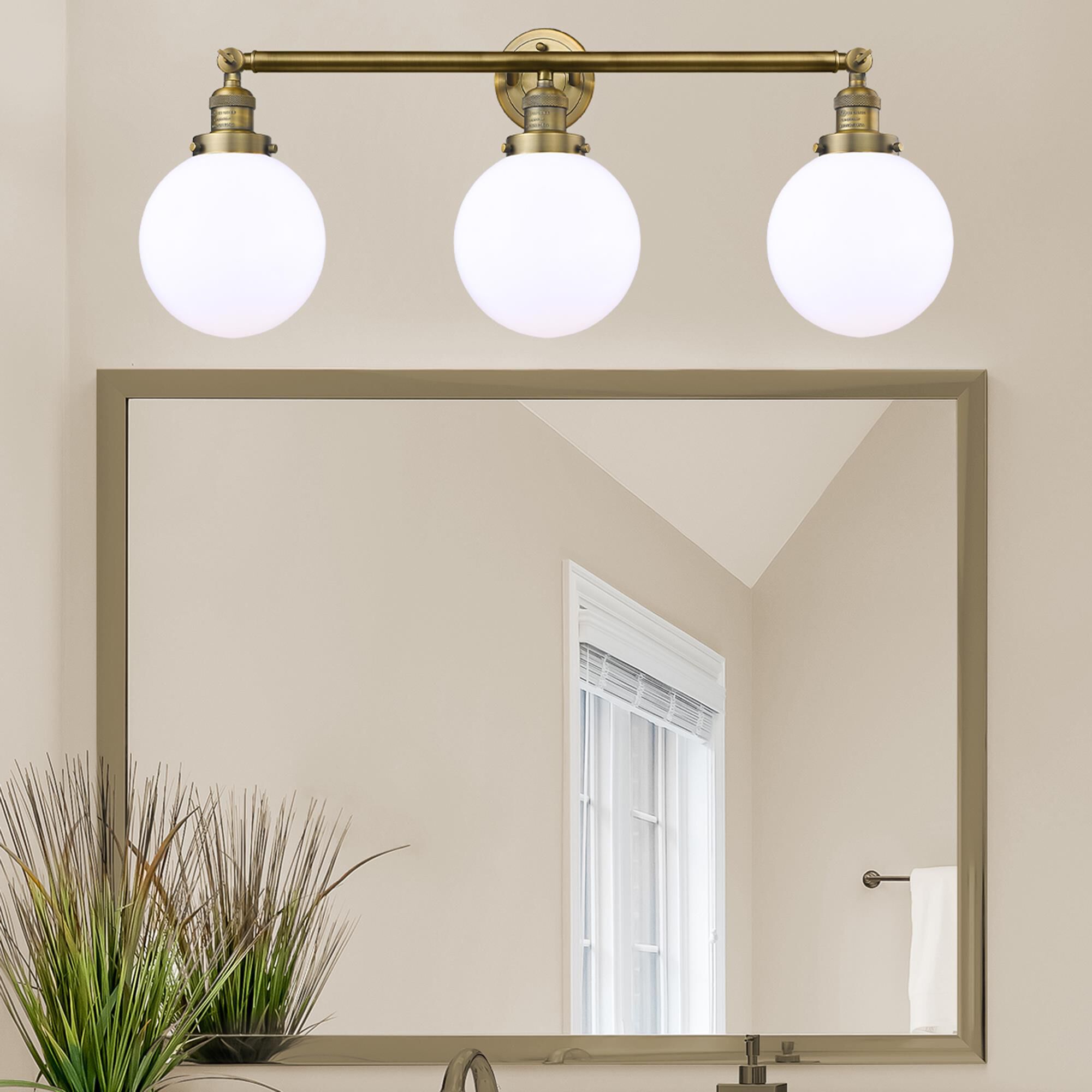 Shown in Brushed Brass finish and Matte White Cased Beacon glass