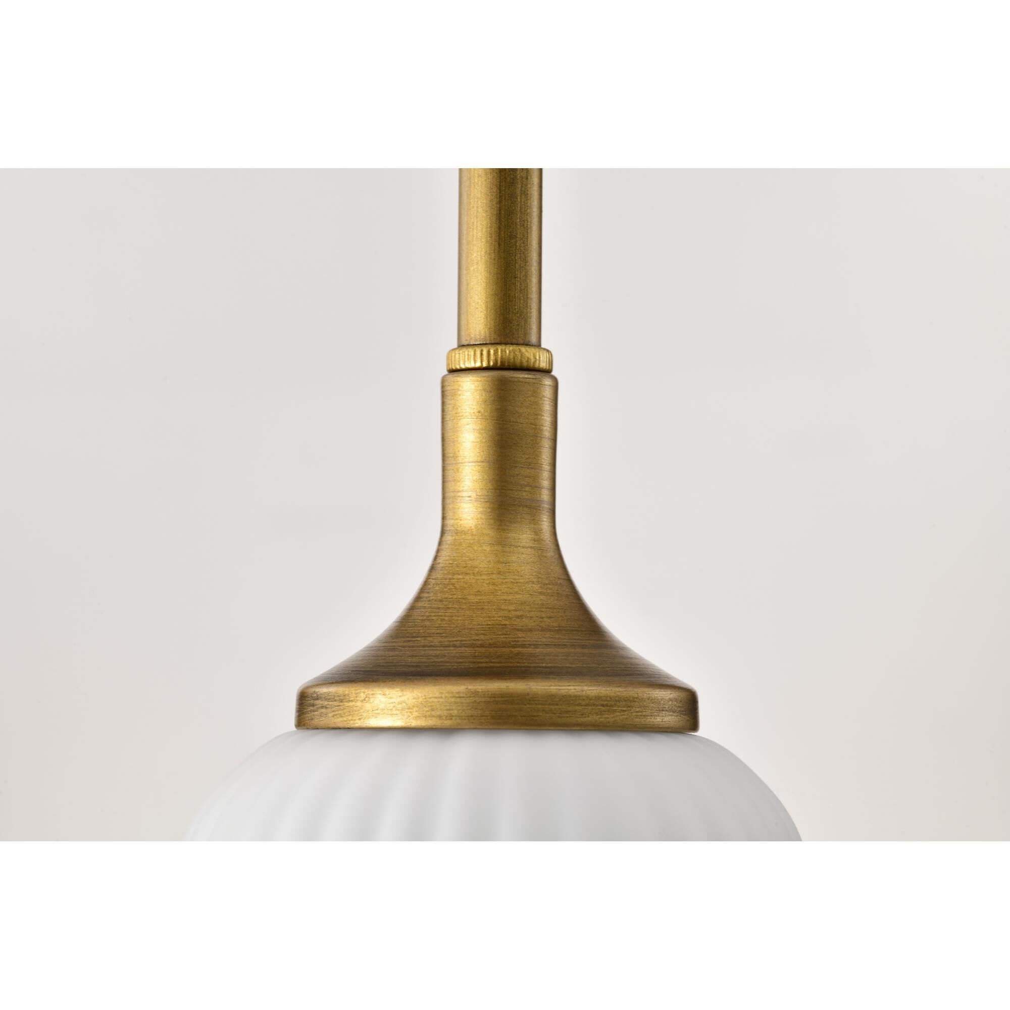 Shown in Natural Brass finish and Frosted Ribbed glass