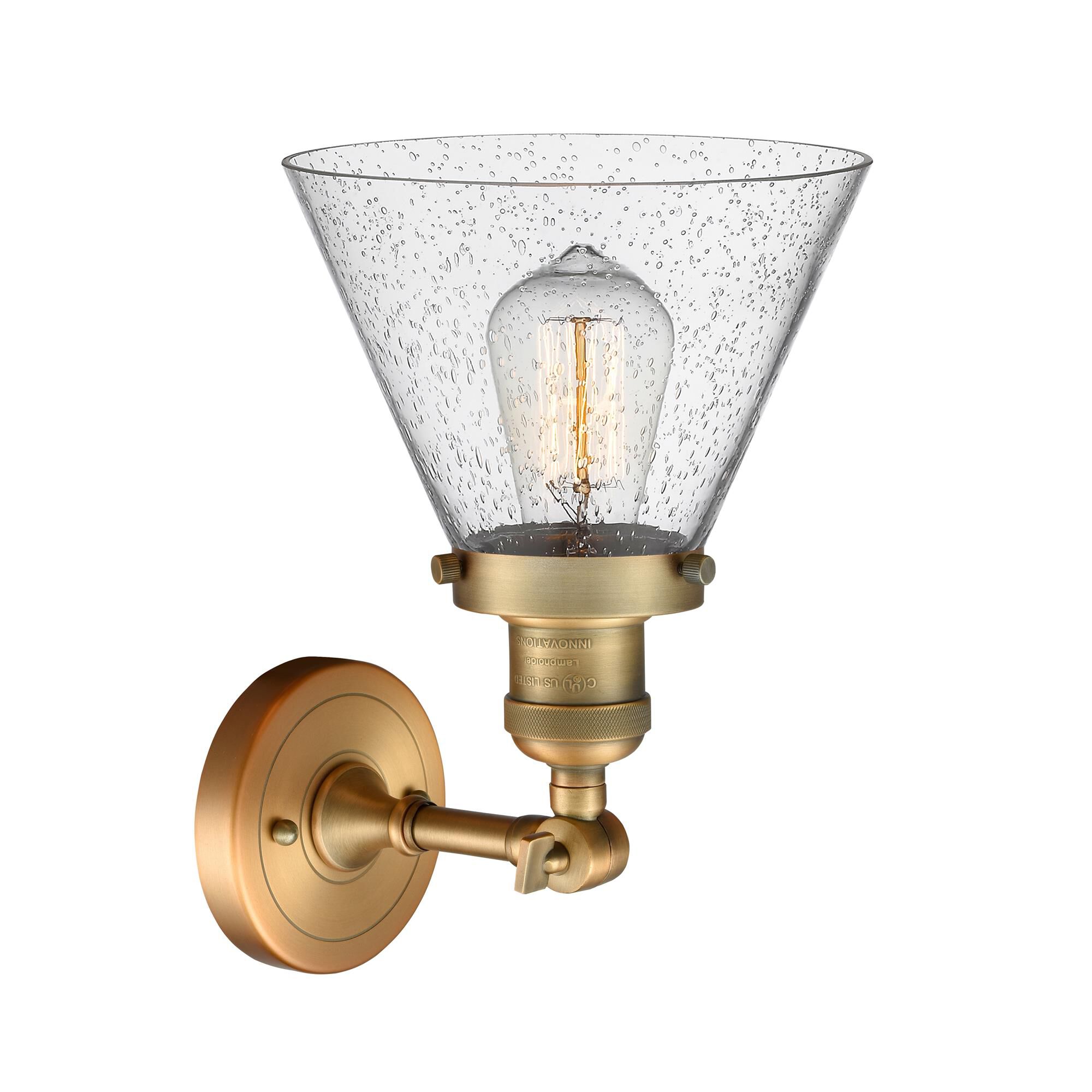 Shown in Brushed Brass finish and Seedy glass