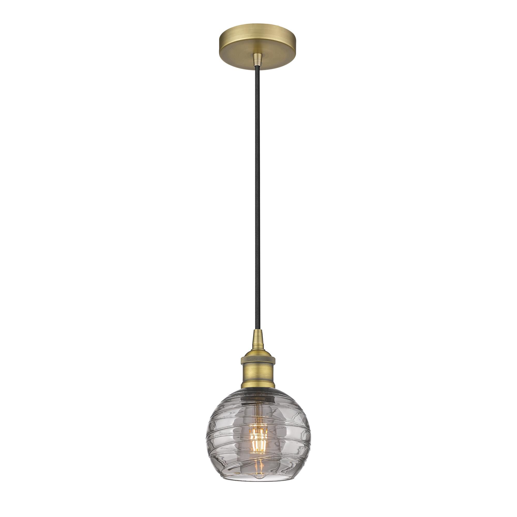 Shown in Brushed Brass finish and Light Smoke Deco Swirl glass