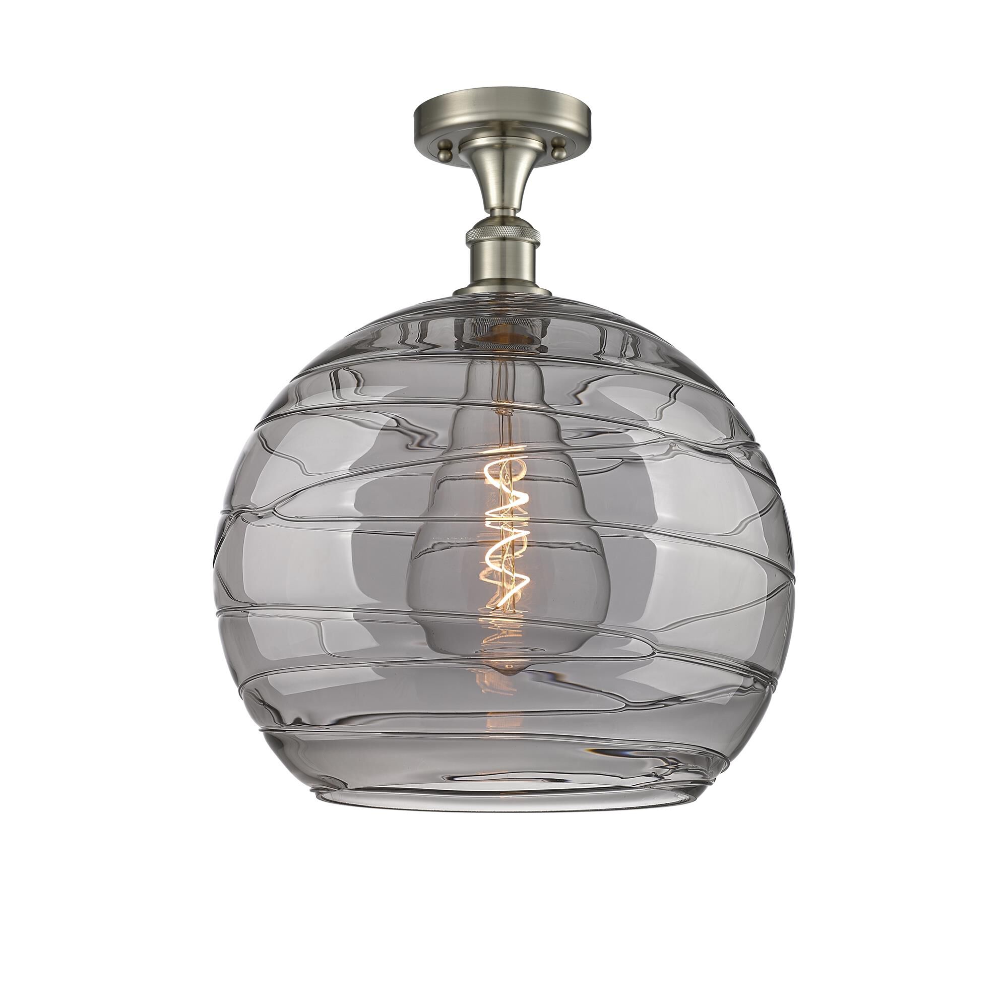 Shown in Brushed Satin Nickel finish and Light Smoke Deco Swirl glass