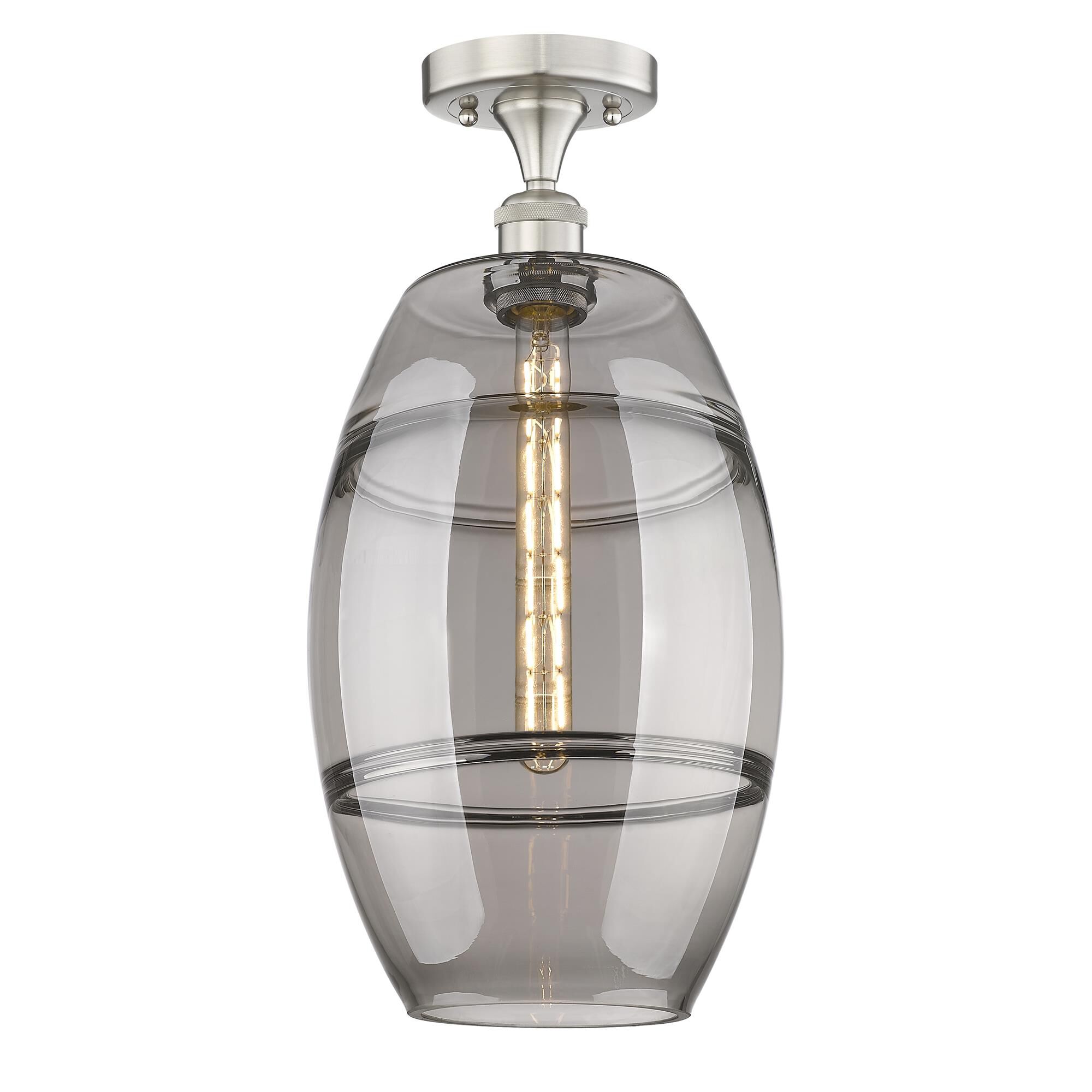 Shown in Brushed Satin Nickel finish and Light Smoke glass