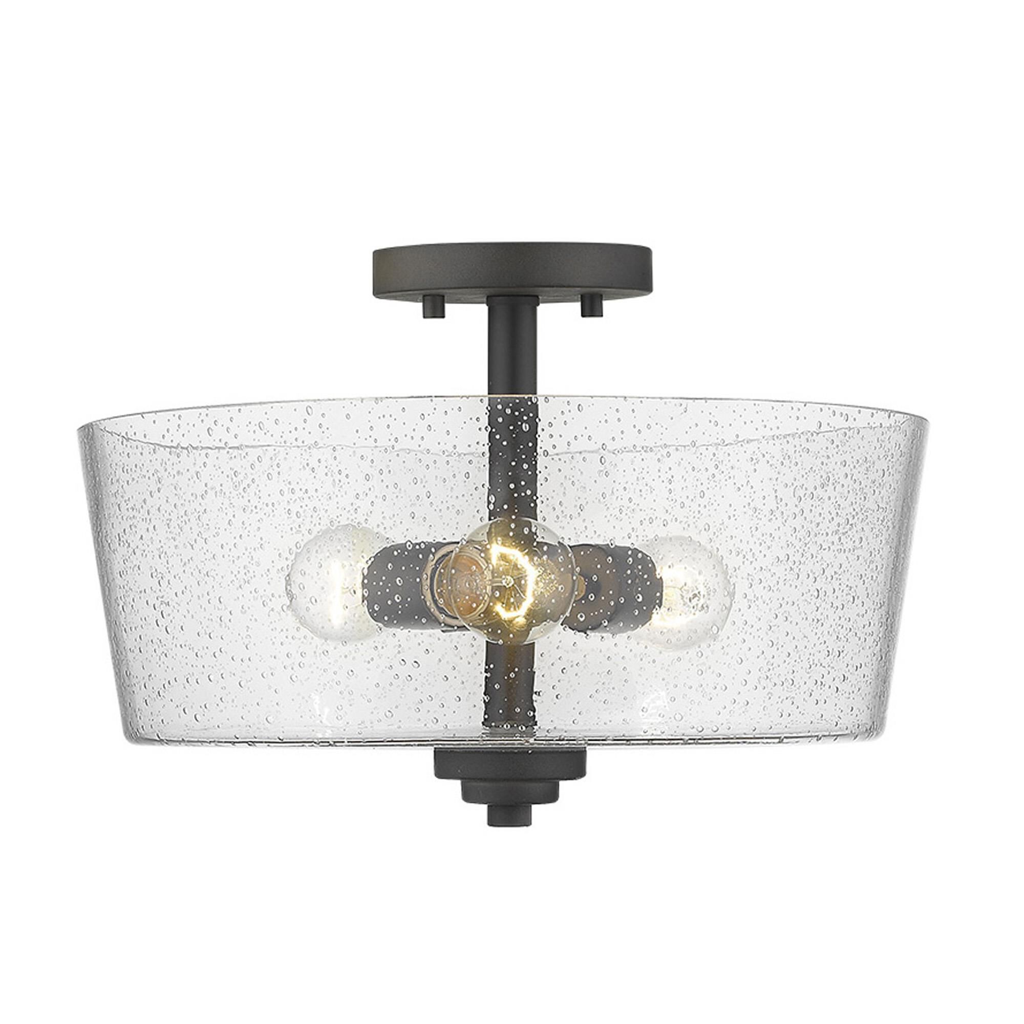 Shown in Oil-Rubbed Bronze finish and Clear glass and Clear, Seeded Drum Shaped Glass shade