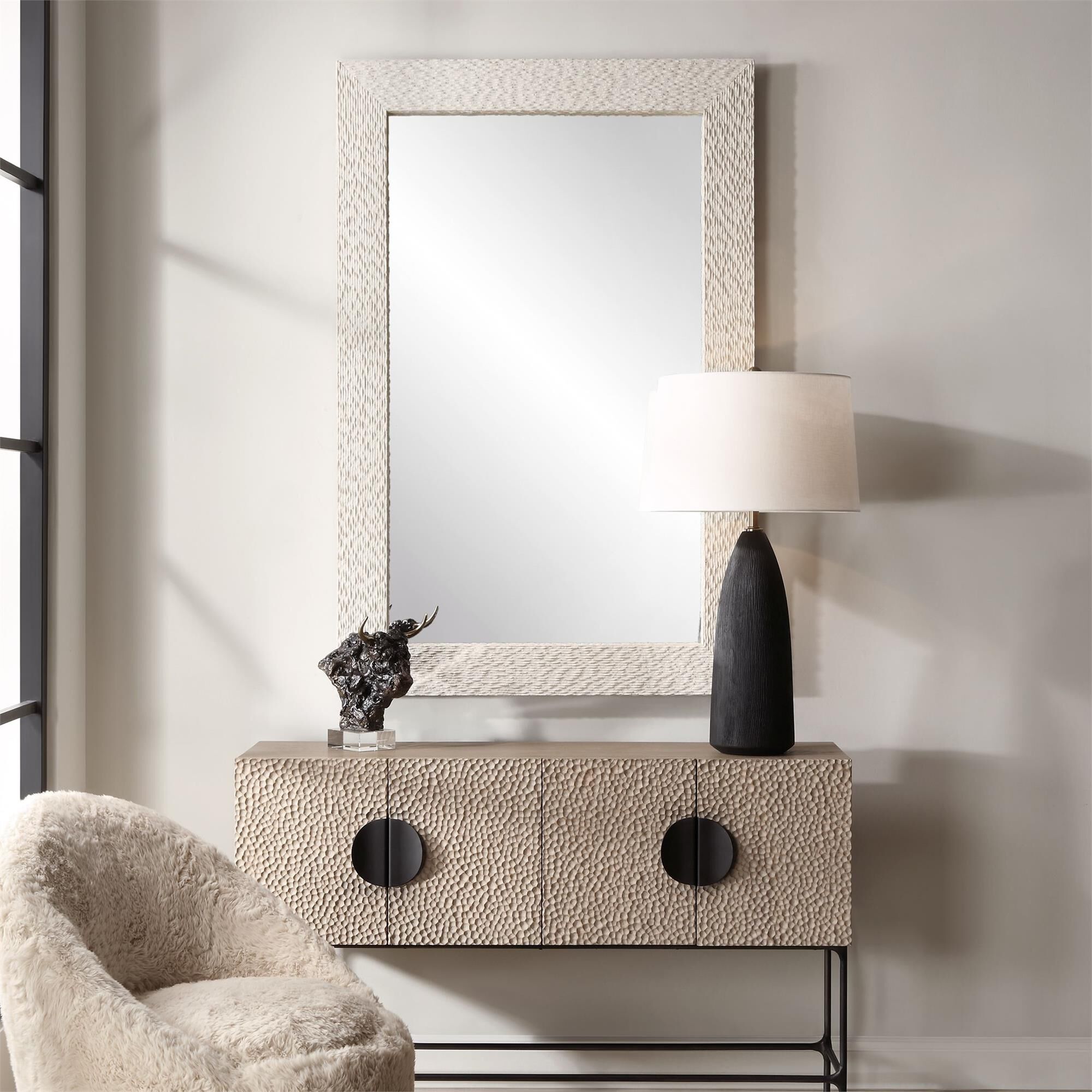 Shown in The Everett Mirror Features A Man-Made Stone Veneer, Characterized By A Heavily Textured Surface, Fi finish