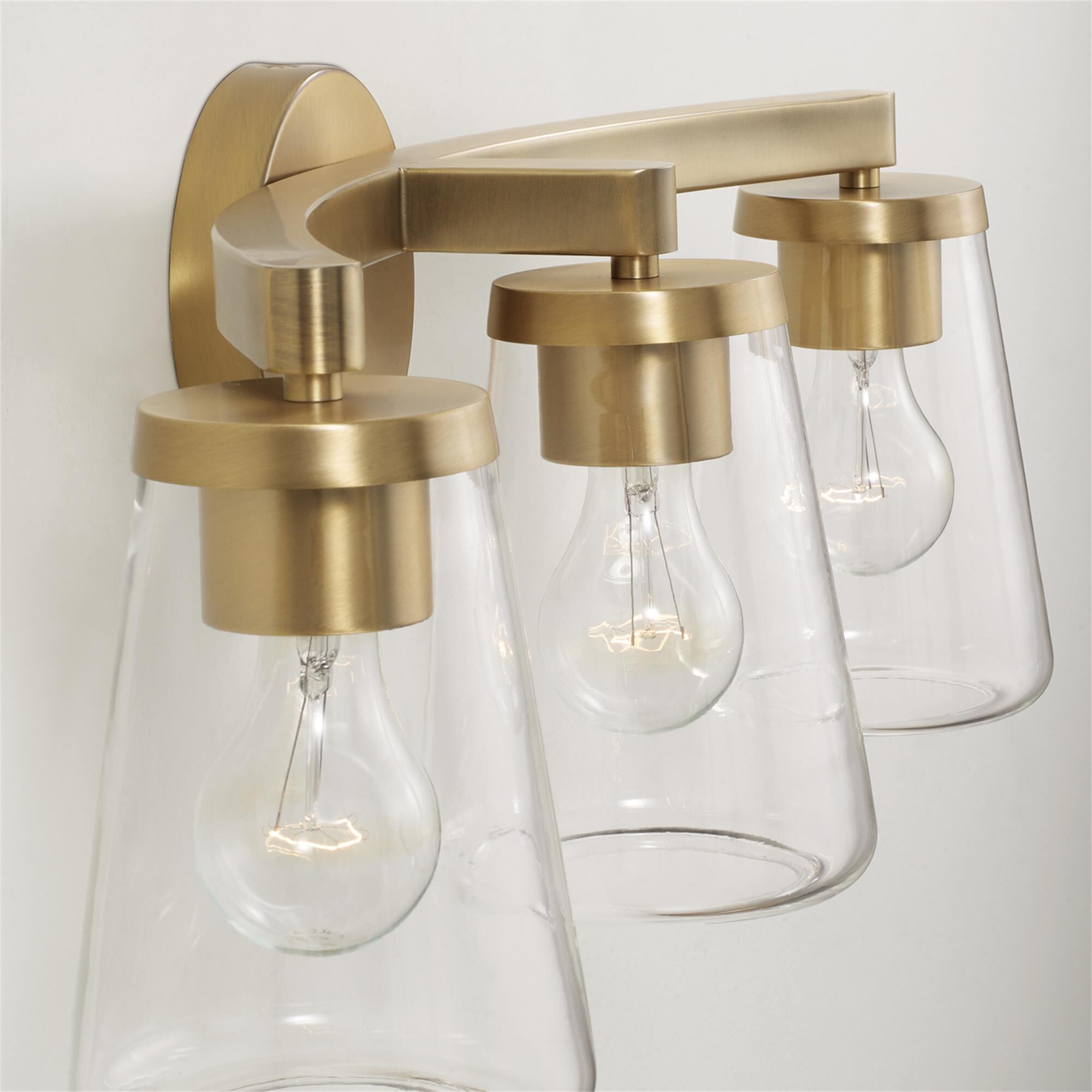 Shown in Aged Brass finish and Clear glass