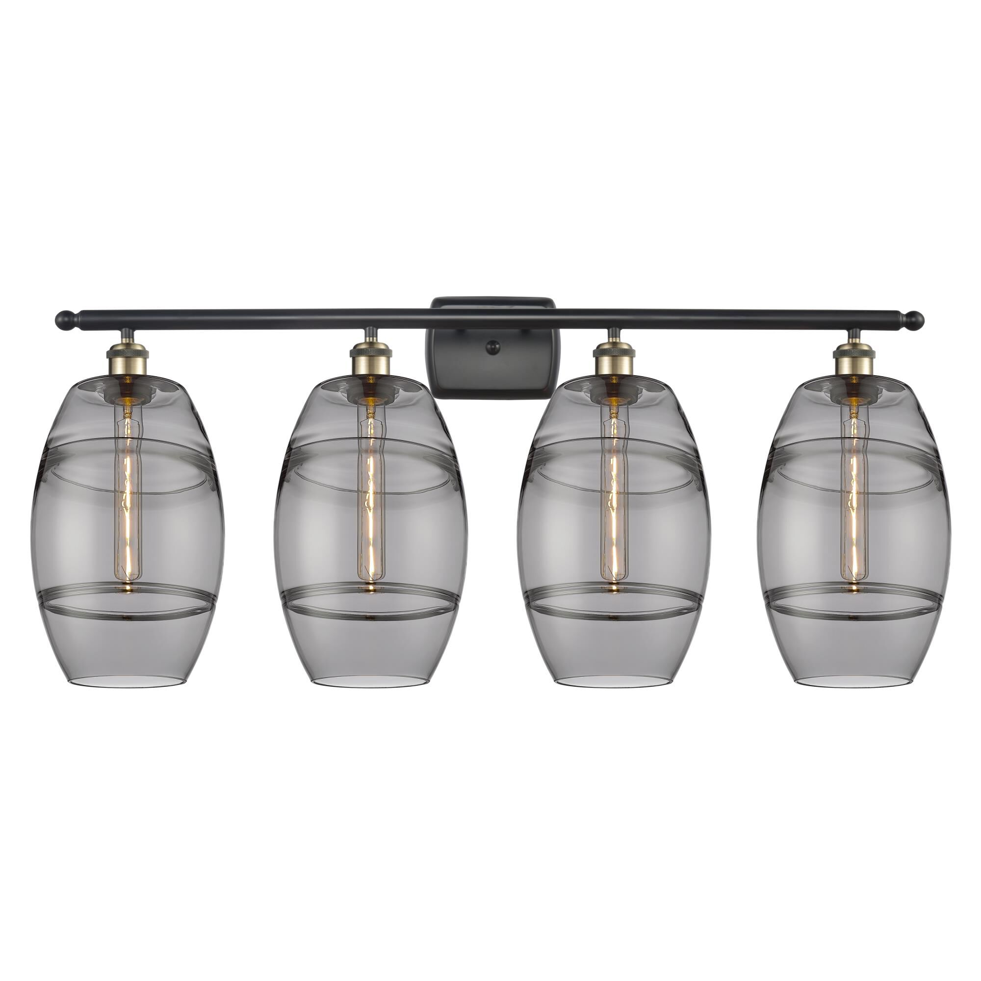 Shown in Black Antique Brass finish and Light Smoke glass