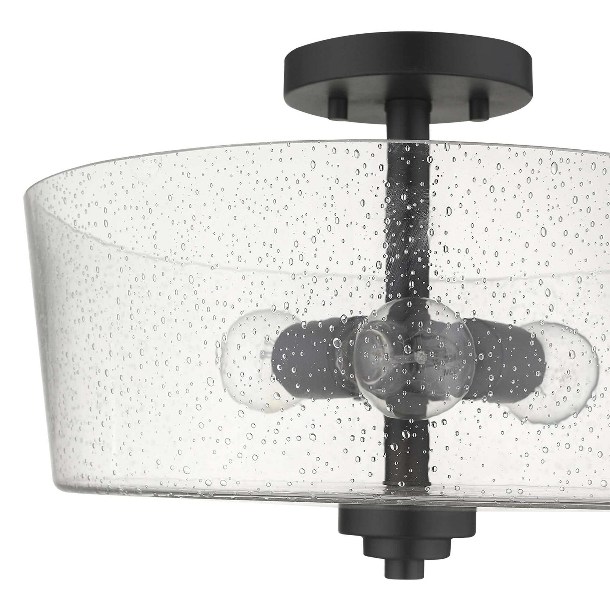 Shown in Matte Black finish and Clear glass and Clear, Seeded Drum Shaped Glass shade