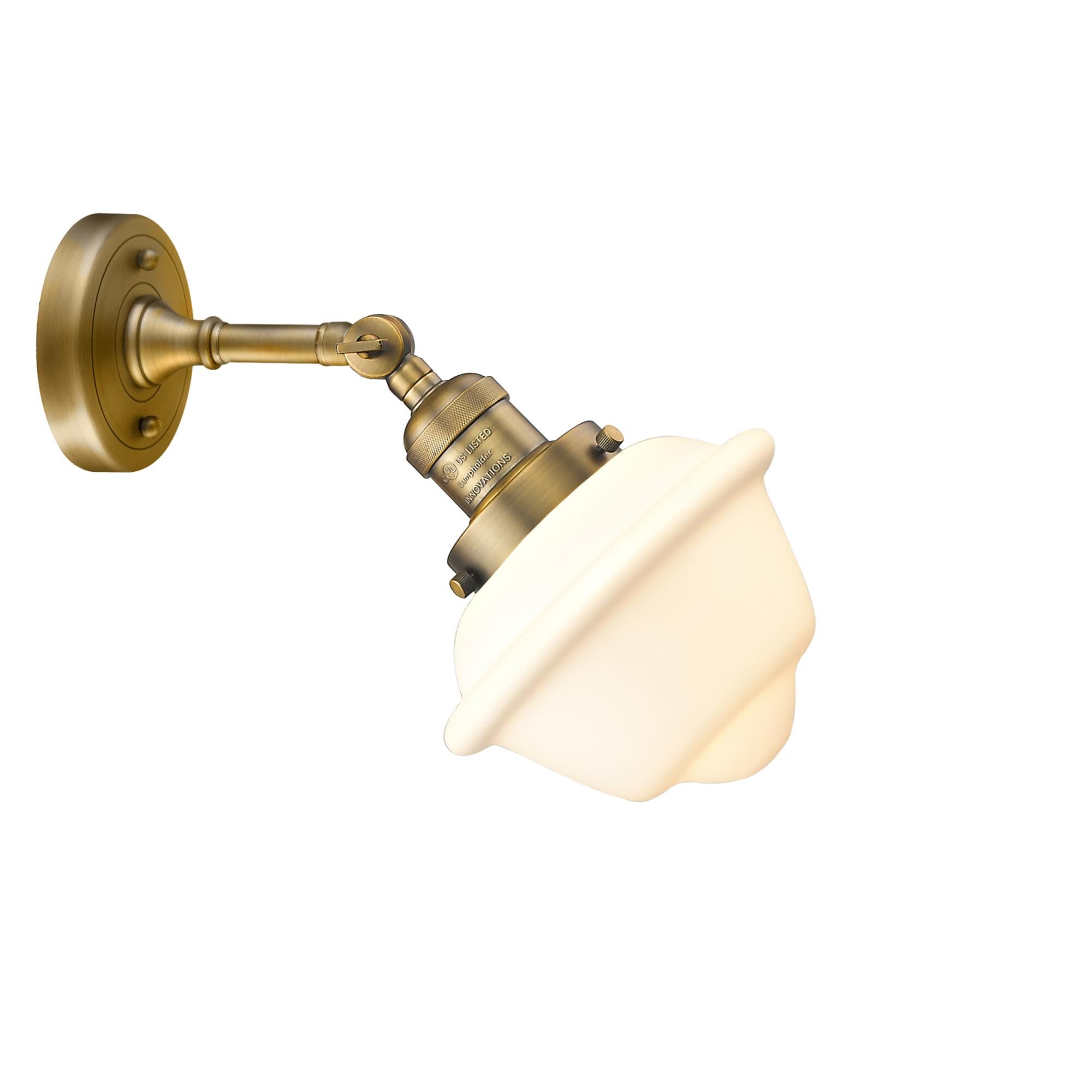 Shown in Brushed Brass finish and Matte White glass